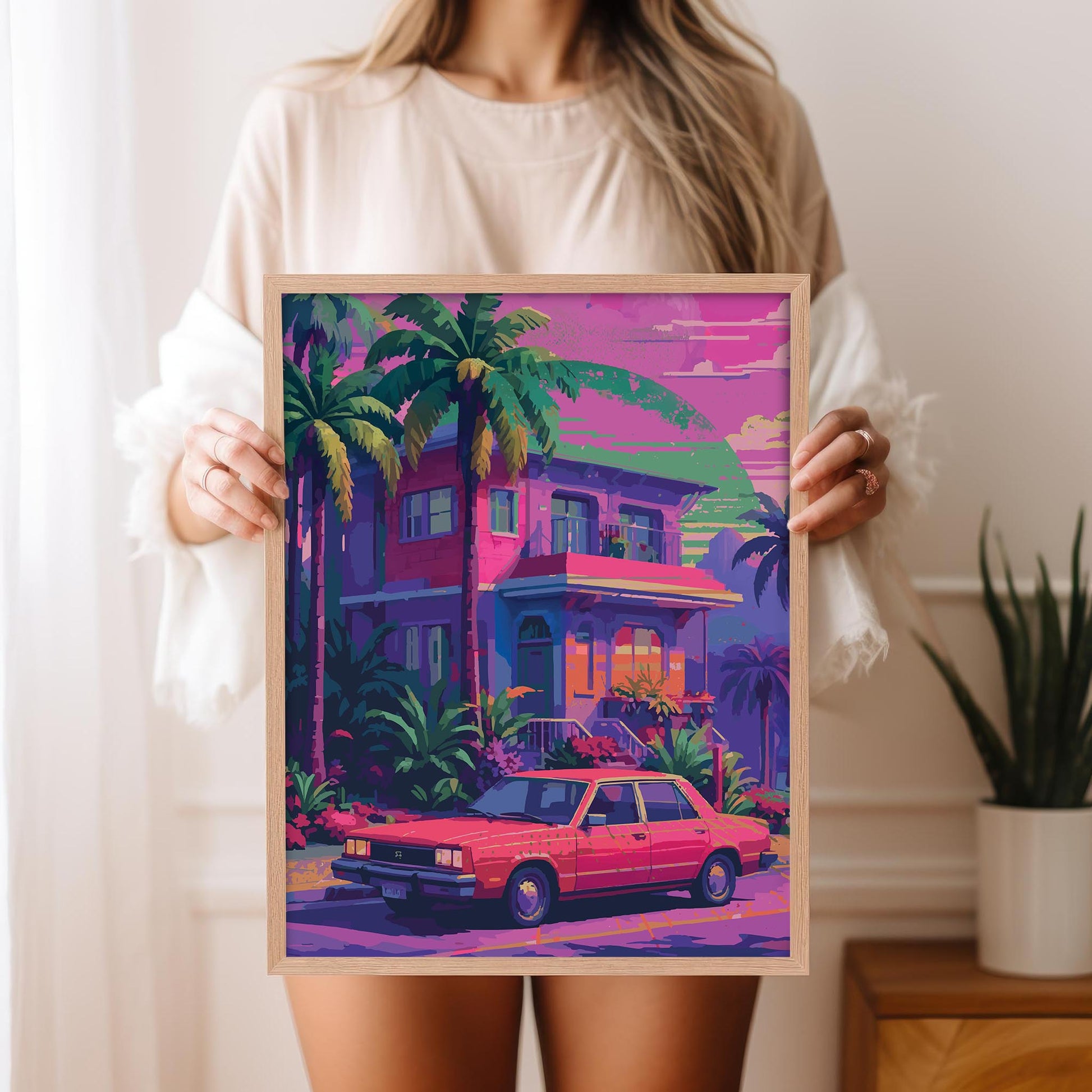 Printable wall art of a vibrant retro-style house with palm trees and a vintage red car parked out front, set against a dreamy sunset sky in pink, purple, and green hues, perfect for colorful, nostalgic home decor.