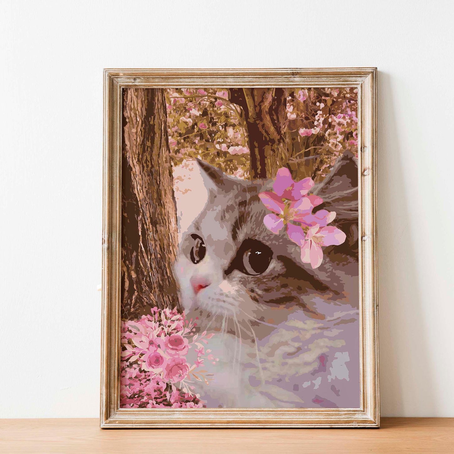 Printable wall art of a close-up of a cat with big, expressive eyes, adorned with pink blossoms, set against a dreamy background of flowering trees and soft floral accents, perfect for romantic and nature-inspired home decor