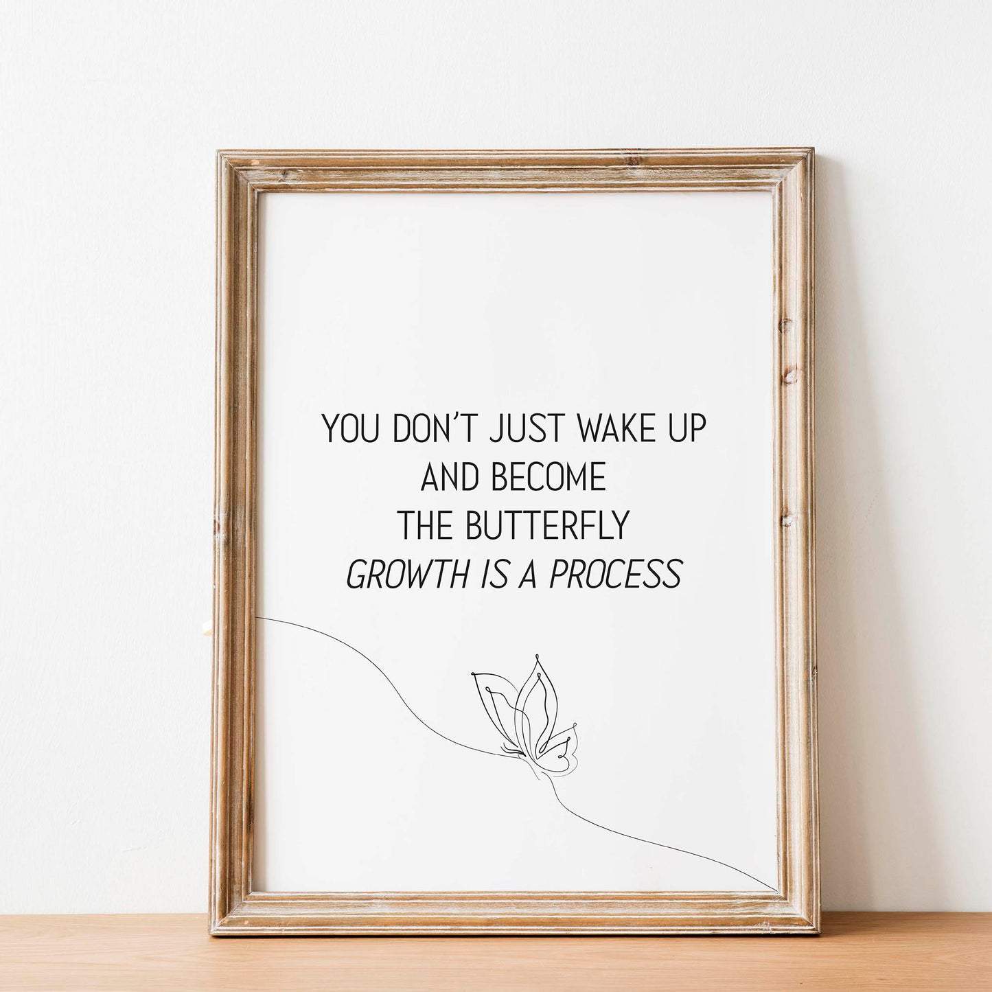Elegant printable wall art featuring the inspirational quote 'You don’t just wake up and become the butterfly - growth is a process' in minimalist black typography, with a delicate one-line butterfly illustration, perfect for self-care, therapy, or personal development decor.