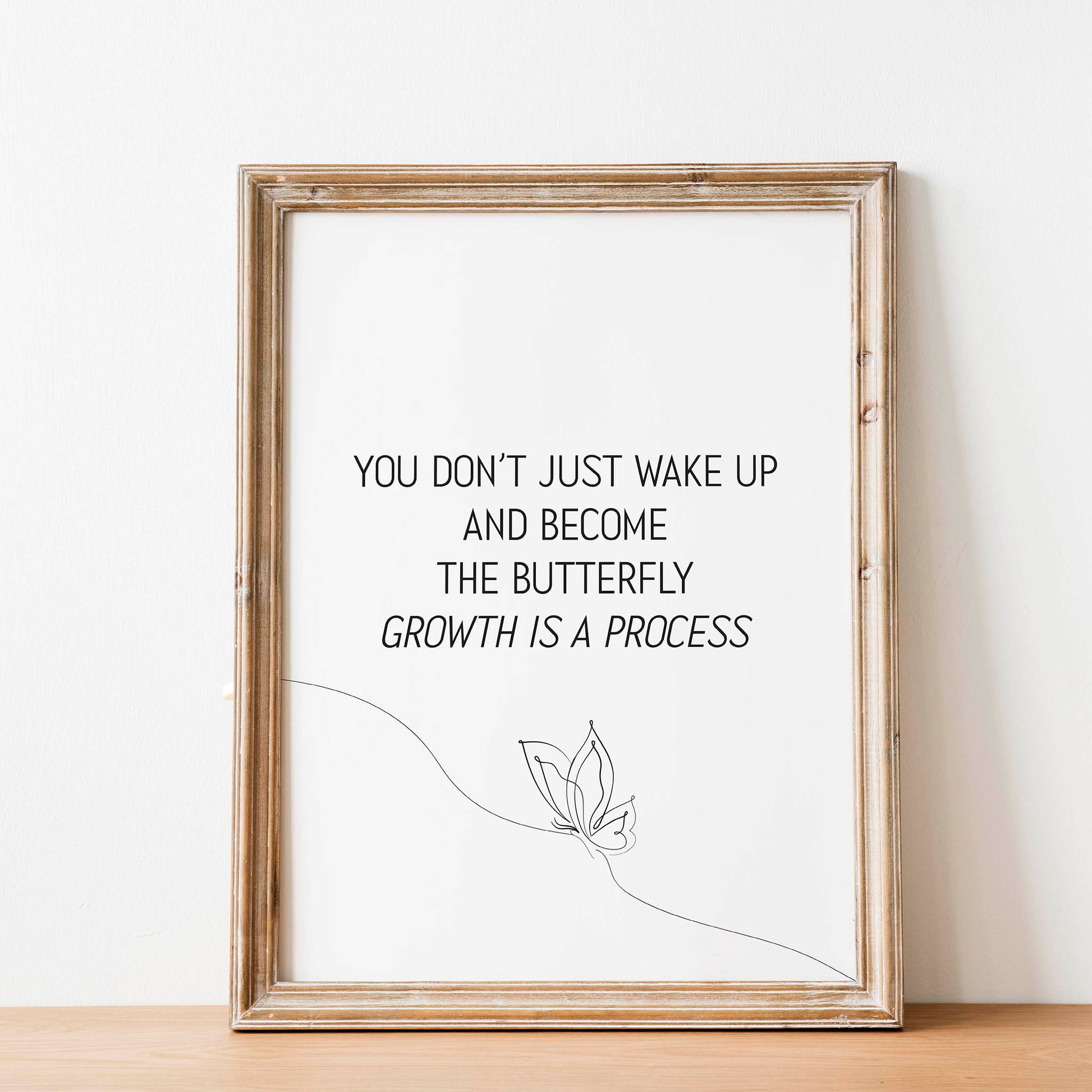 Elegant printable wall art featuring the inspirational quote 'You don’t just wake up and become the butterfly - growth is a process' in minimalist black typography, with a delicate one-line butterfly illustration, perfect for self-care, therapy, or personal development decor.