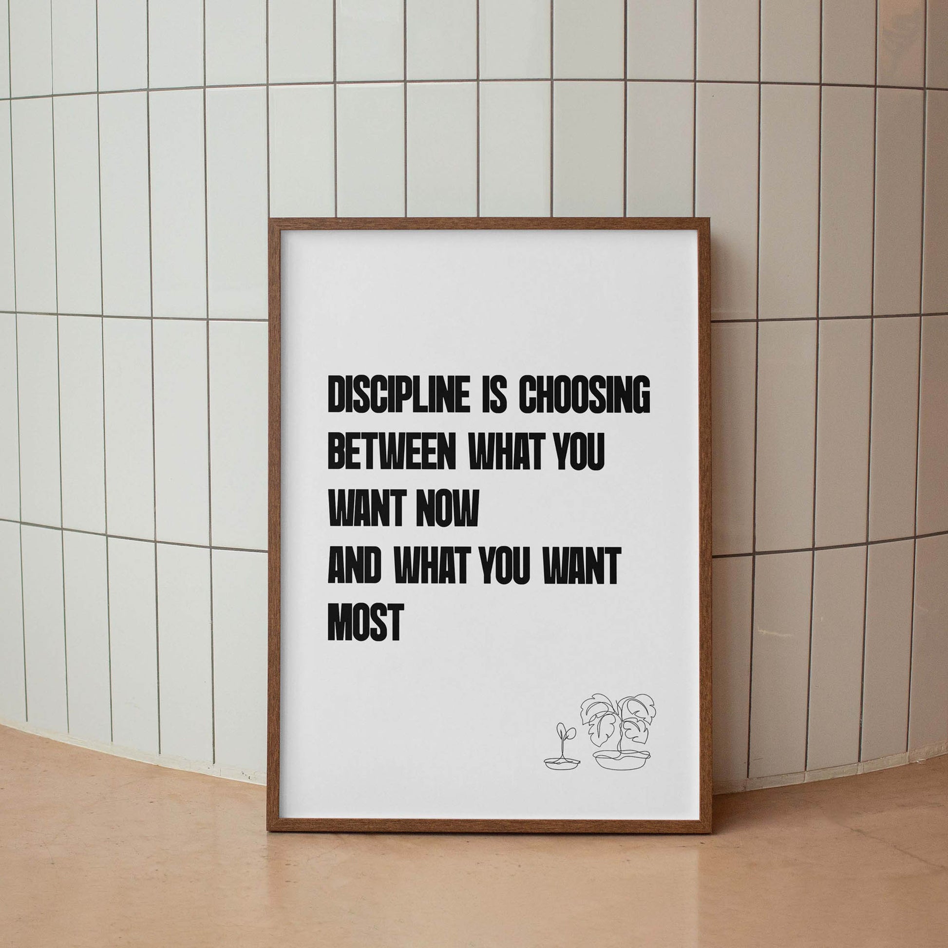 Motivational printable wall art featuring the quote 'Discipline is choosing between what you want now and what you want most' in bold black uppercase text, with minimalist line art of two potted plants on a white background - perfect for productivity, gym, or goal-setting decor.