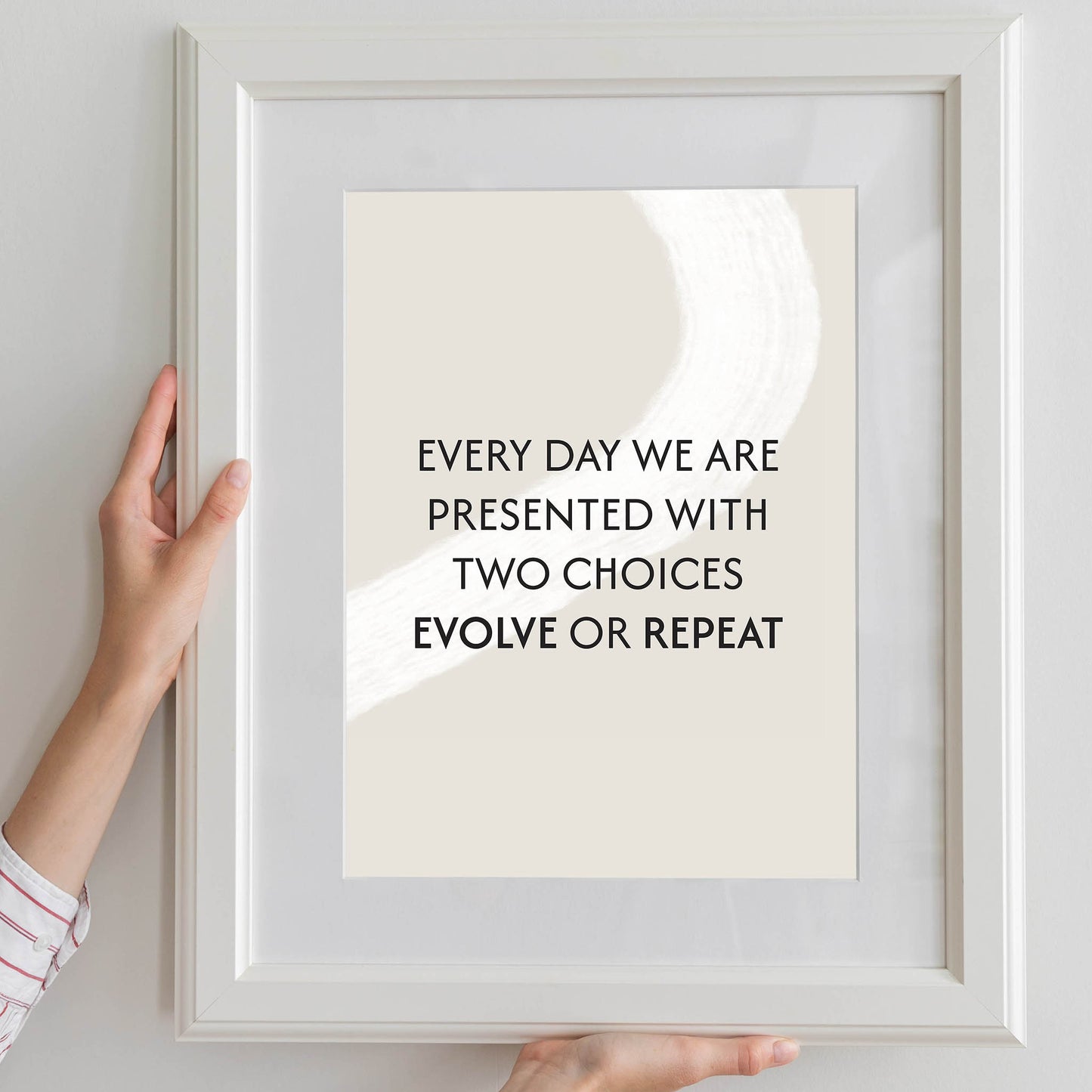 Motivational printable wall art with the quote 'Every day we are presented with two choices - evolve or repeat' in bold black typography on a neutral beige background with abstract white brushstroke - ideal for mindset, growth, or self-improvement decor
