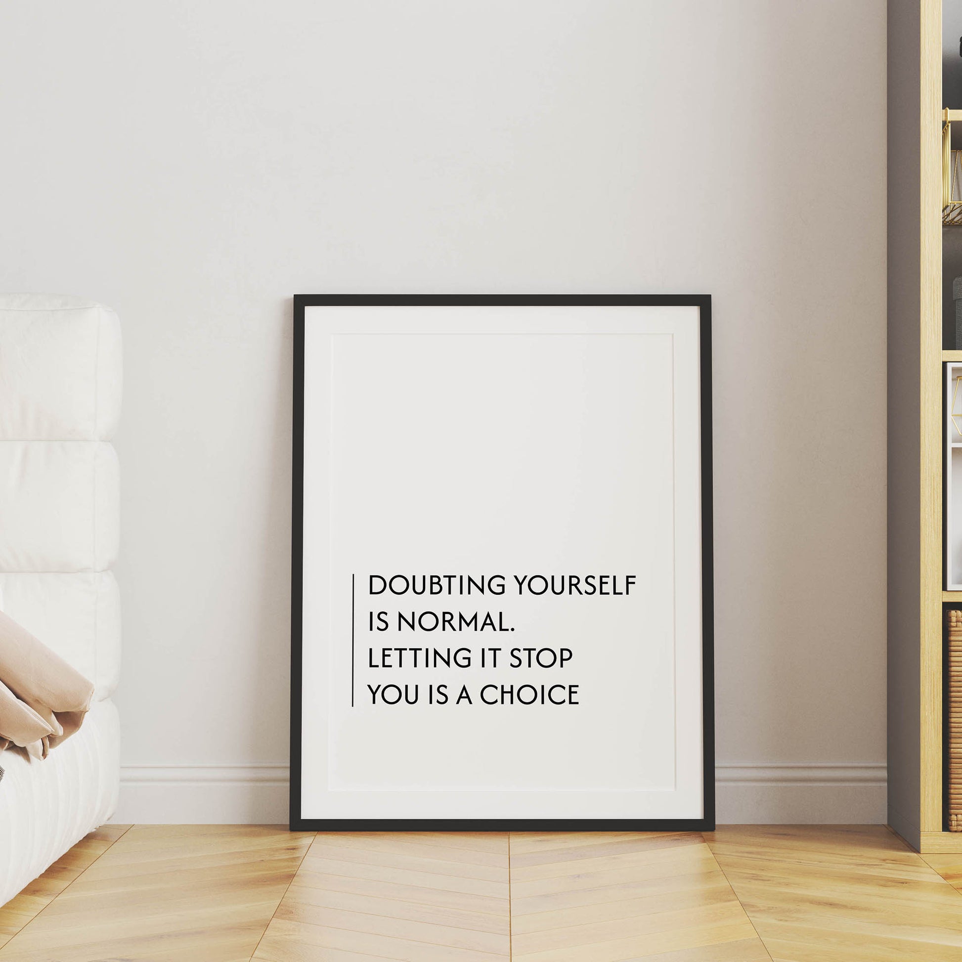 Minimalist motivational printable wall art with the quote 'Doubting yourself is normal. Letting it stop you is a choice' in clean black typography, set against a soft beige background with natural window light - ideal for office, bedroom, or personal growth spaces