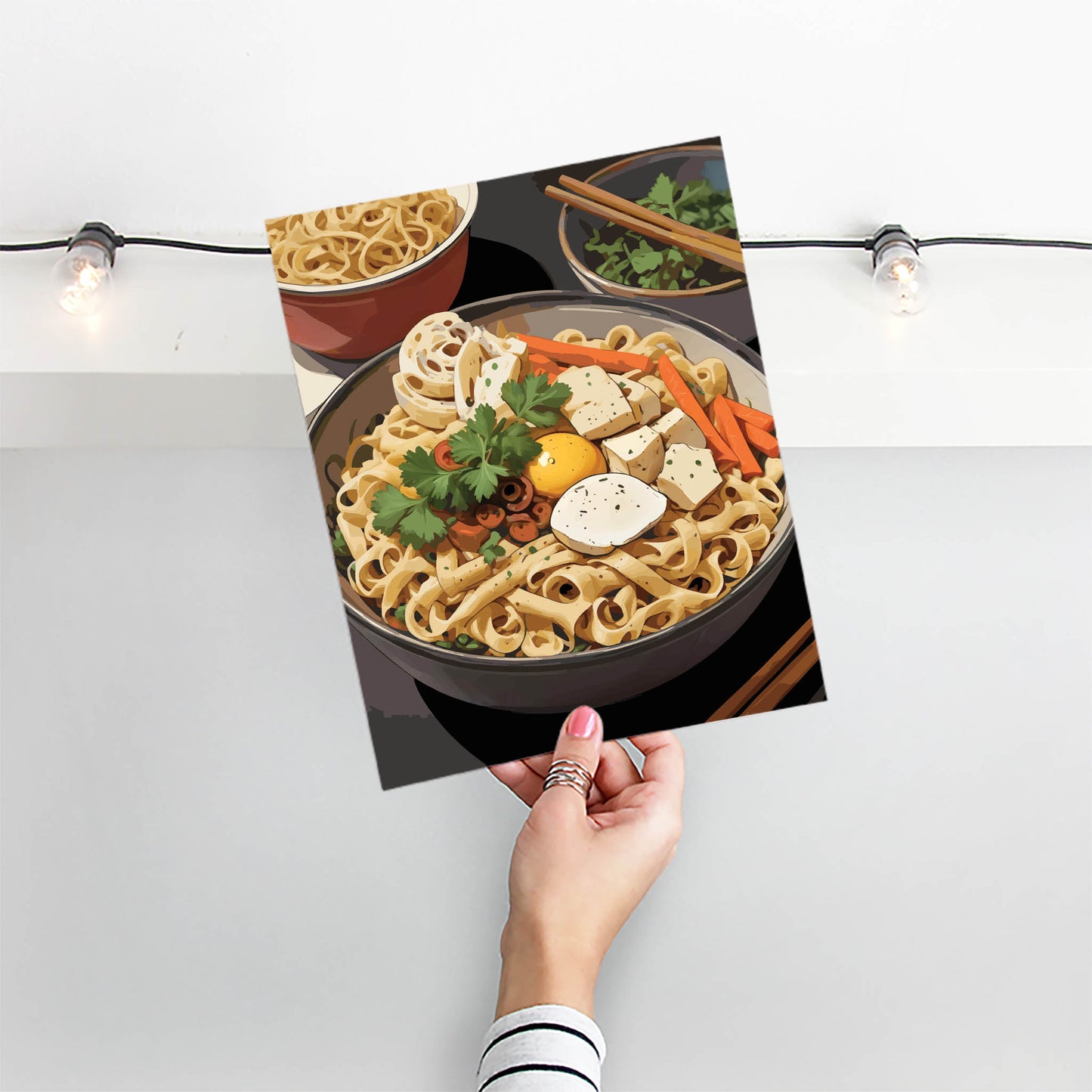 Printable wall art of a colorful bowl of noodles topped with tofu, egg yolk, vegetables, lotus root, and fresh herbs, styled with chopsticks and side dishes, perfect for kitchen or dining room decor with a foodie vibe.