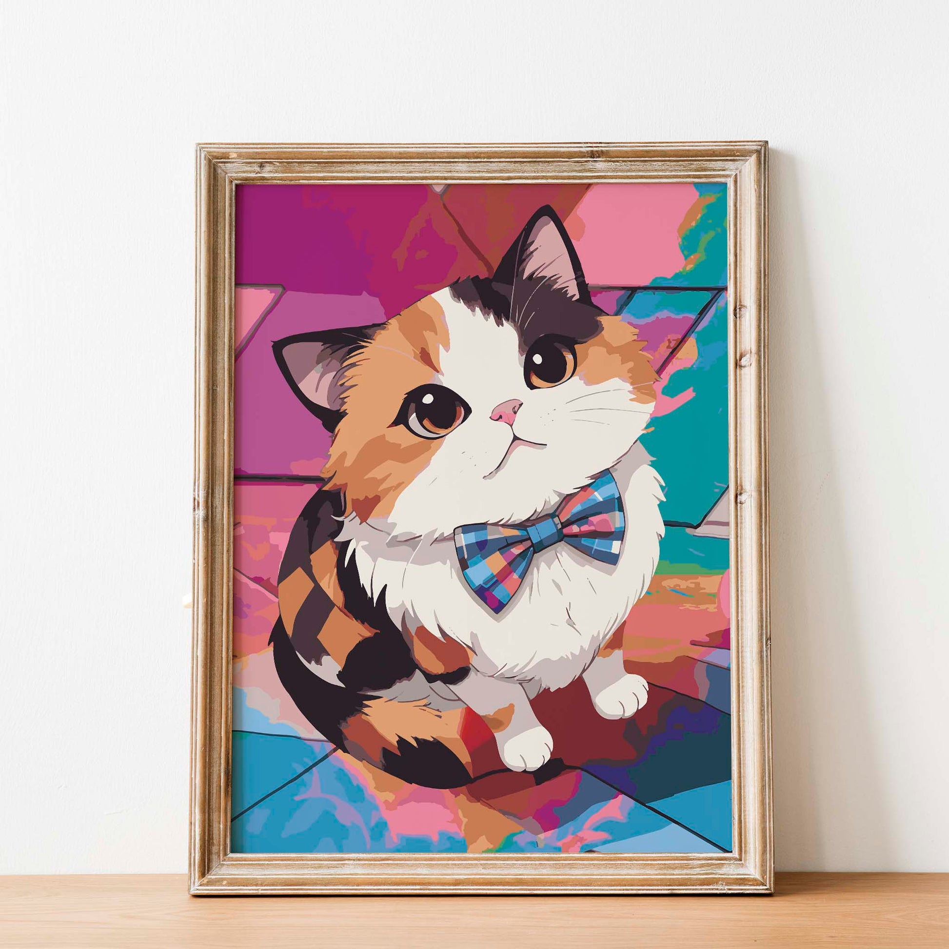 Printable wall art of a cute calico cat wearing a colorful plaid bow tie, sitting against a vibrant geometric background, perfect for cat lovers and playful, modern home decor