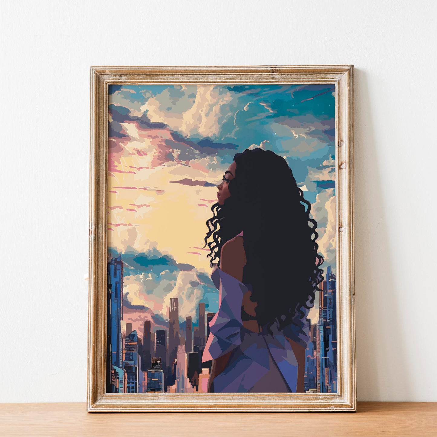 Modern cityscape printable wall art featuring a confident woman with long curly hair gazing at a vibrant sunset skyline - perfect for urban, empowering, and contemporary decor themes
