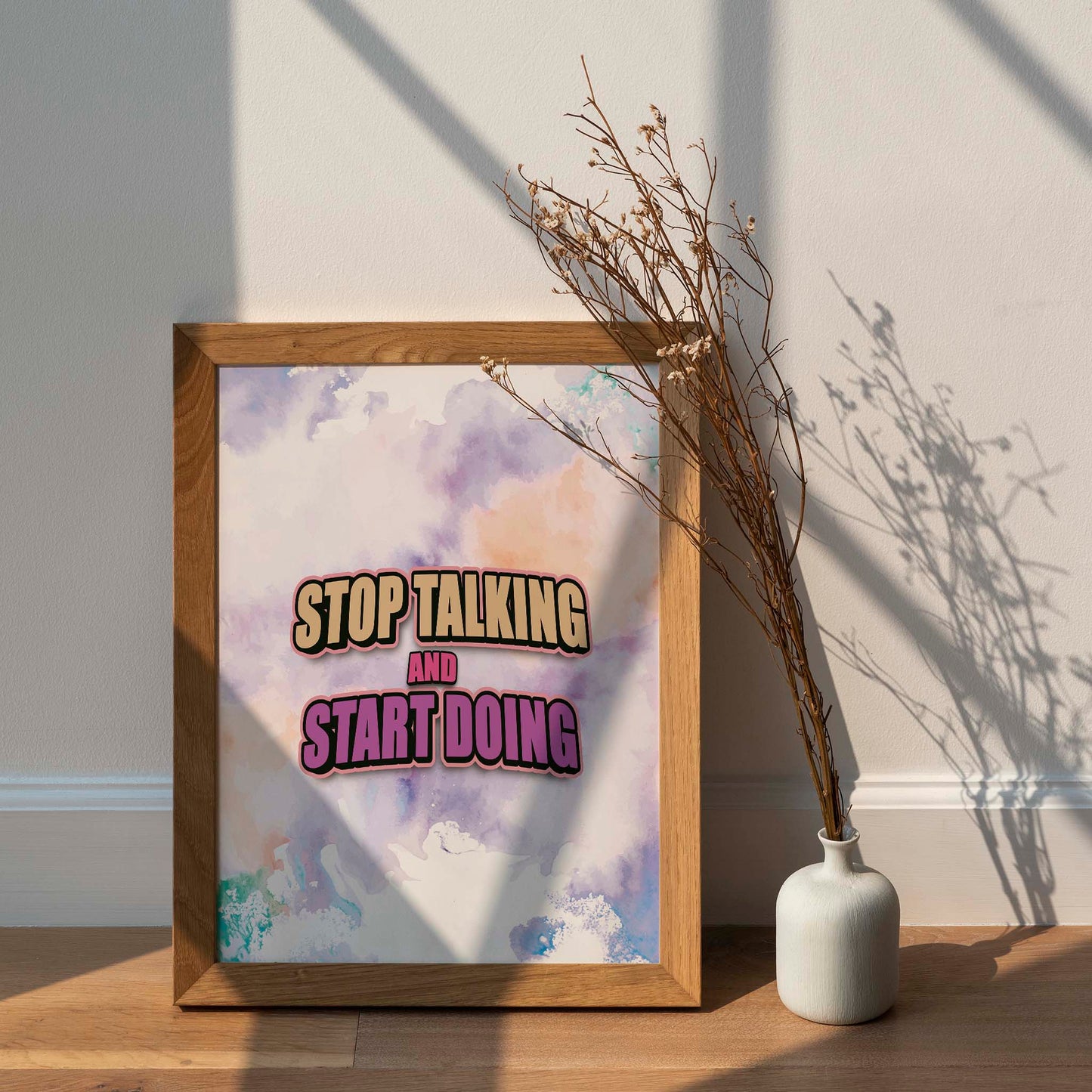 Bold motivational printable wall art featuring the quote 'Stop Talking and Start Doing' in dynamic beige and purple typography over a colourful pastel watercolour background, perfect for energising offices, gyms, or creative workspaces.