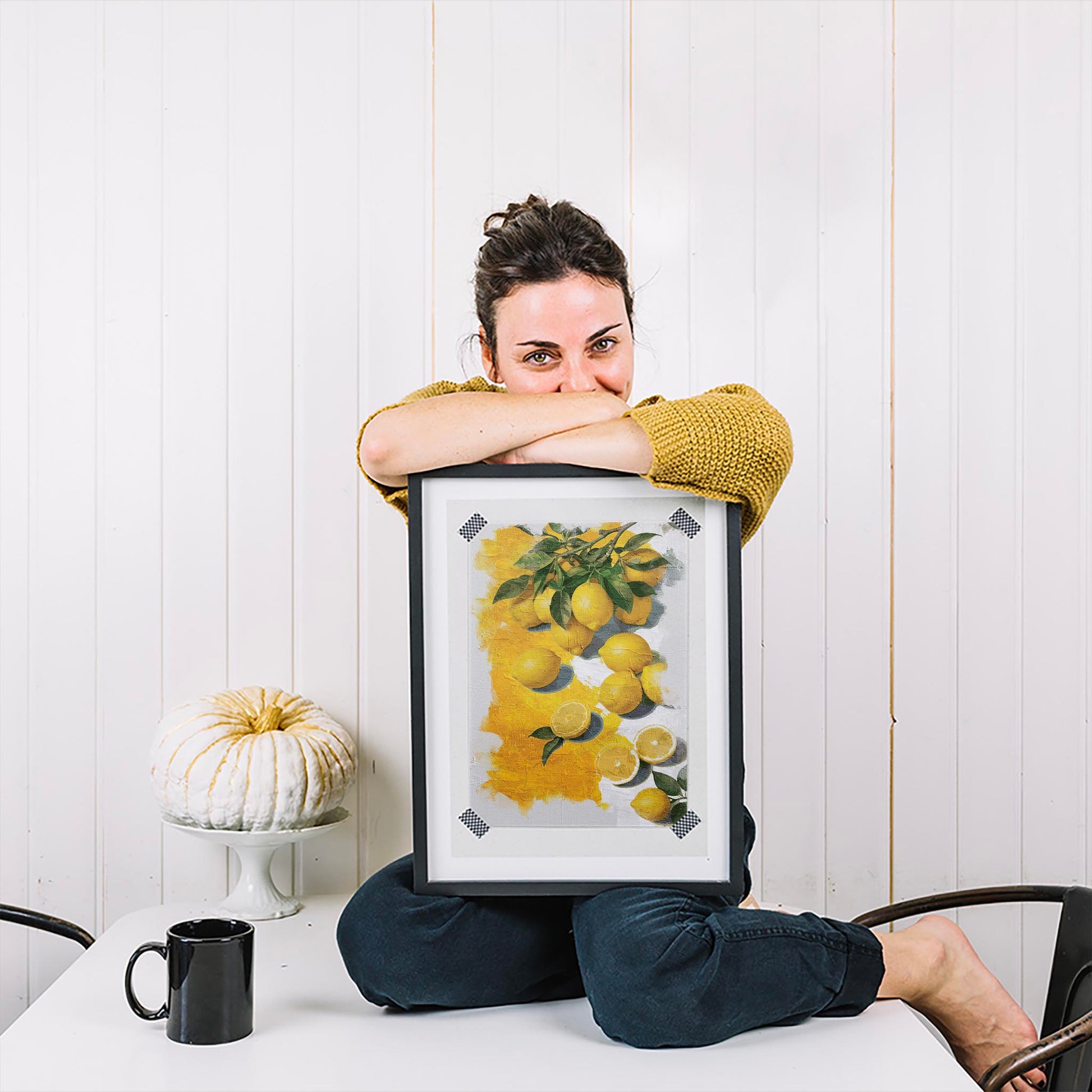 Printable wall art of vibrant yellow lemons with green leaves, some whole and some sliced, set against a textured white and yellow painted background, perfect for kitchen, farmhouse, or citrus-themed decor