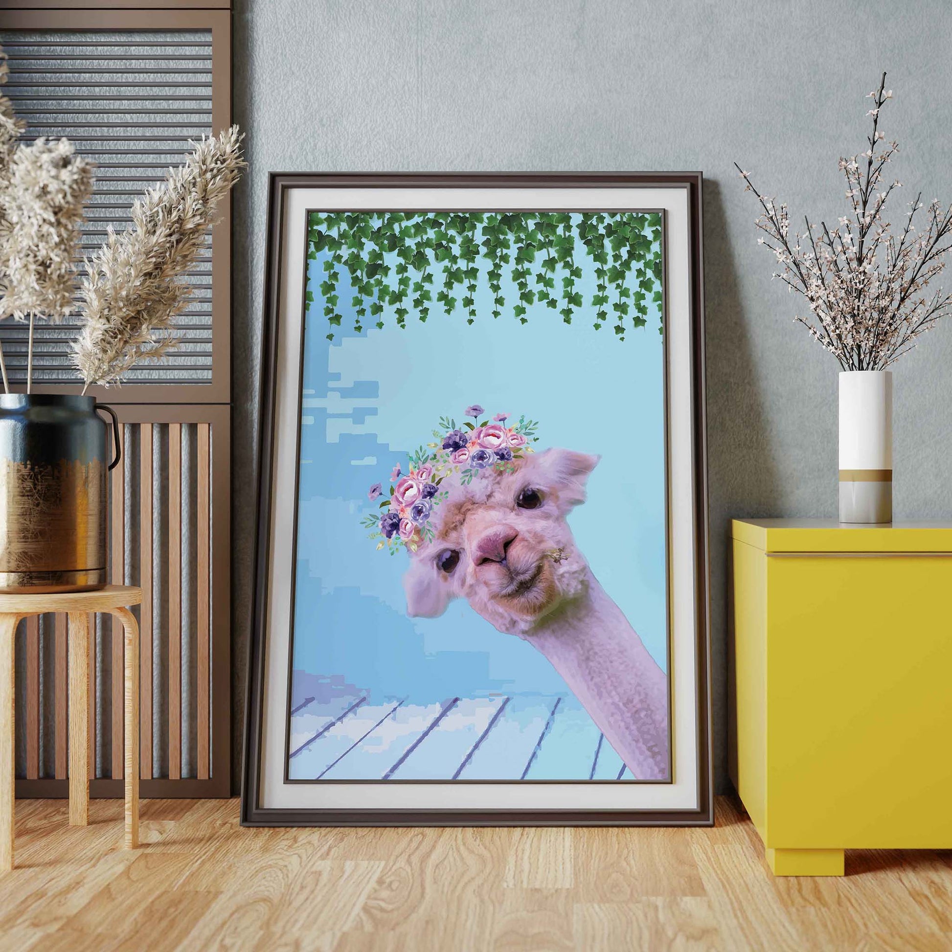 Whimsical printable wall art featuring a cute alpaca with a floral crown, set against a pastel blue background with hanging greenery, perfect for kids’ rooms, nurseries, or boho animal decor lovers.