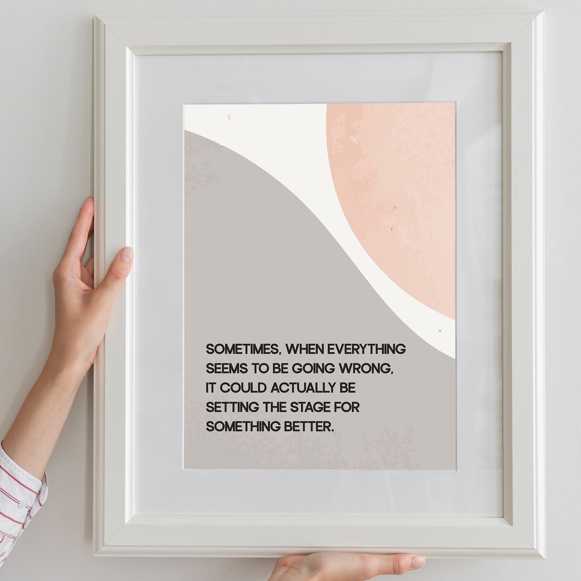 Modern motivational printable wall art featuring the quote 'Sometimes, when everything seems to be going wrong, it could actually be setting the stage for something better' in black text over abstract curved shapes in soft beige and peach tones, perfect for uplifting and calming interior spaces