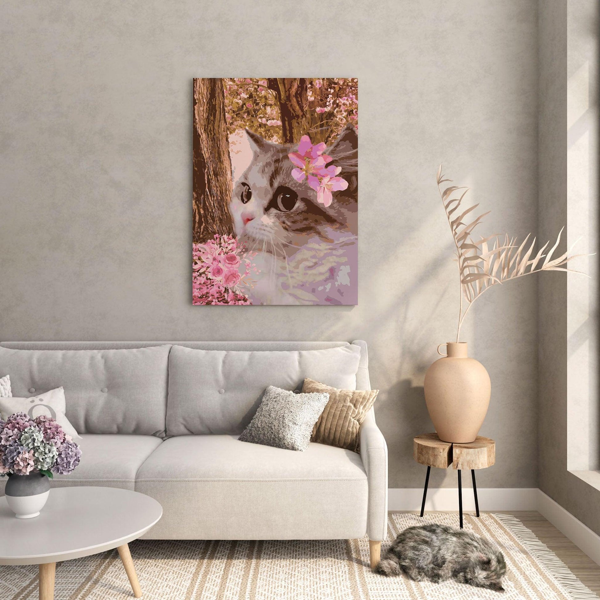 Printable wall art of a close-up of a cat with big, expressive eyes, adorned with pink blossoms, set against a dreamy background of flowering trees and soft floral accents, perfect for romantic and nature-inspired home decor