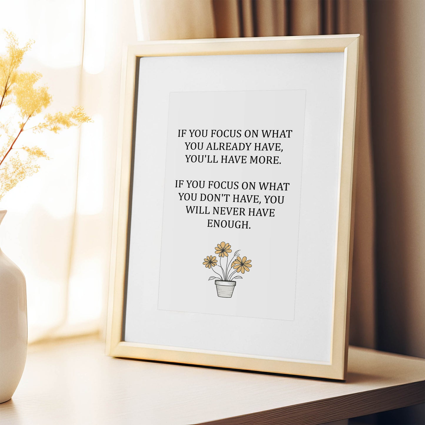 Inspirational printable wall art featuring the quote 'If you focus on what you already have, you'll have more. If you focus on what you don't have, you will never have enough,' with a simple daisy flower pot illustration and soft neutral background, ideal for gratitude-focused or minimalist decor