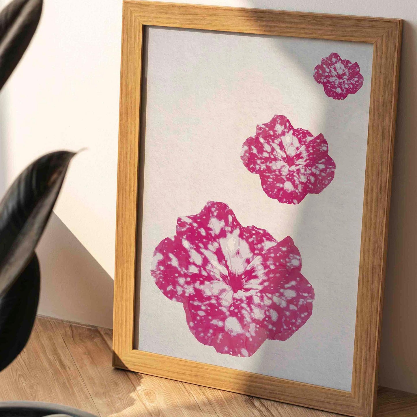 Minimalist floral wall art featuring three vibrant pink and white speckled blossoms on a soft textured background, modern botanical printable perfect for contemporary home decor.