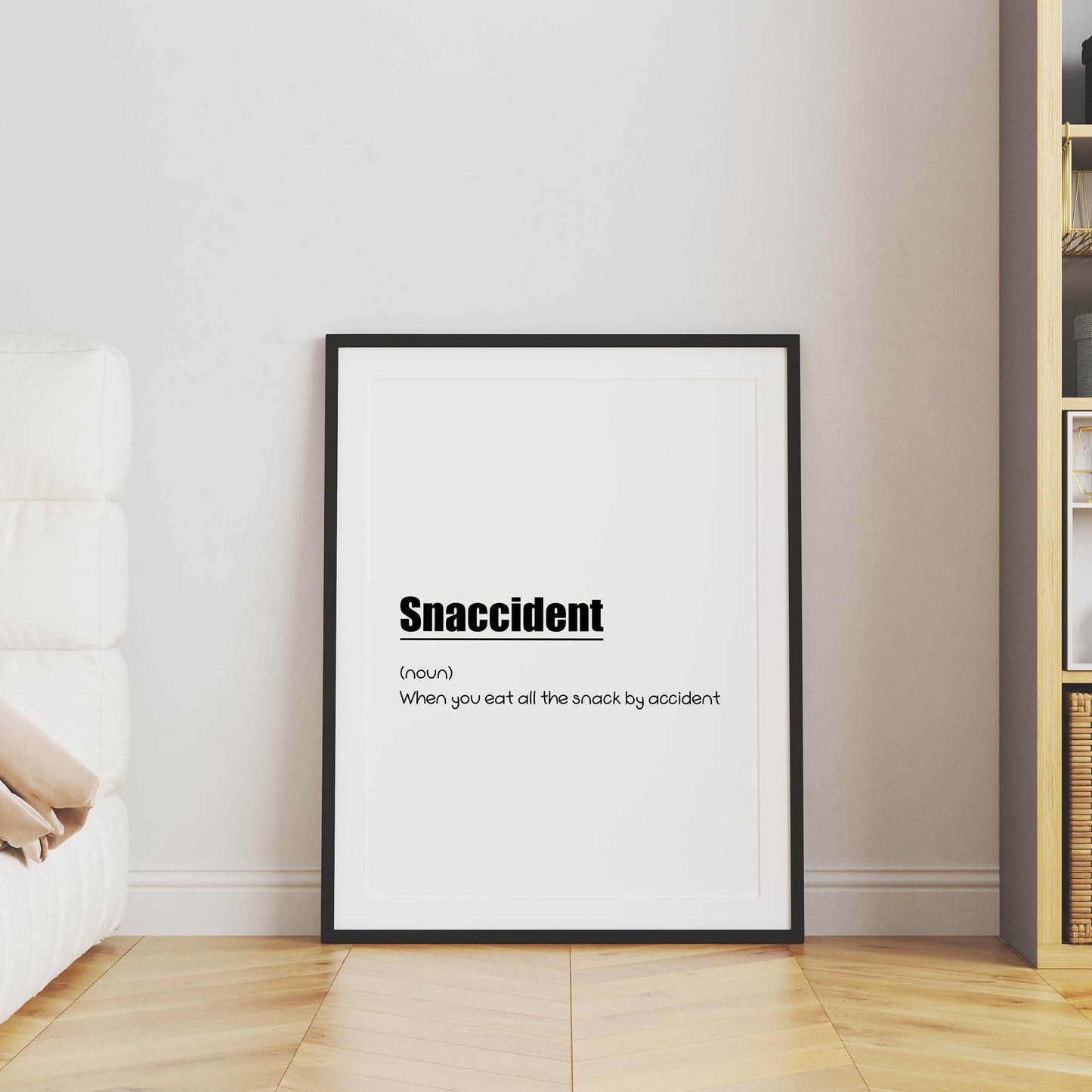 Funny printable wall art with the humorous definition 'Snaccident (noun): When you eat all the snack by accident' in playful black typography on a clean white background - perfect for kitchens, dining areas, or gift decor for food lovers