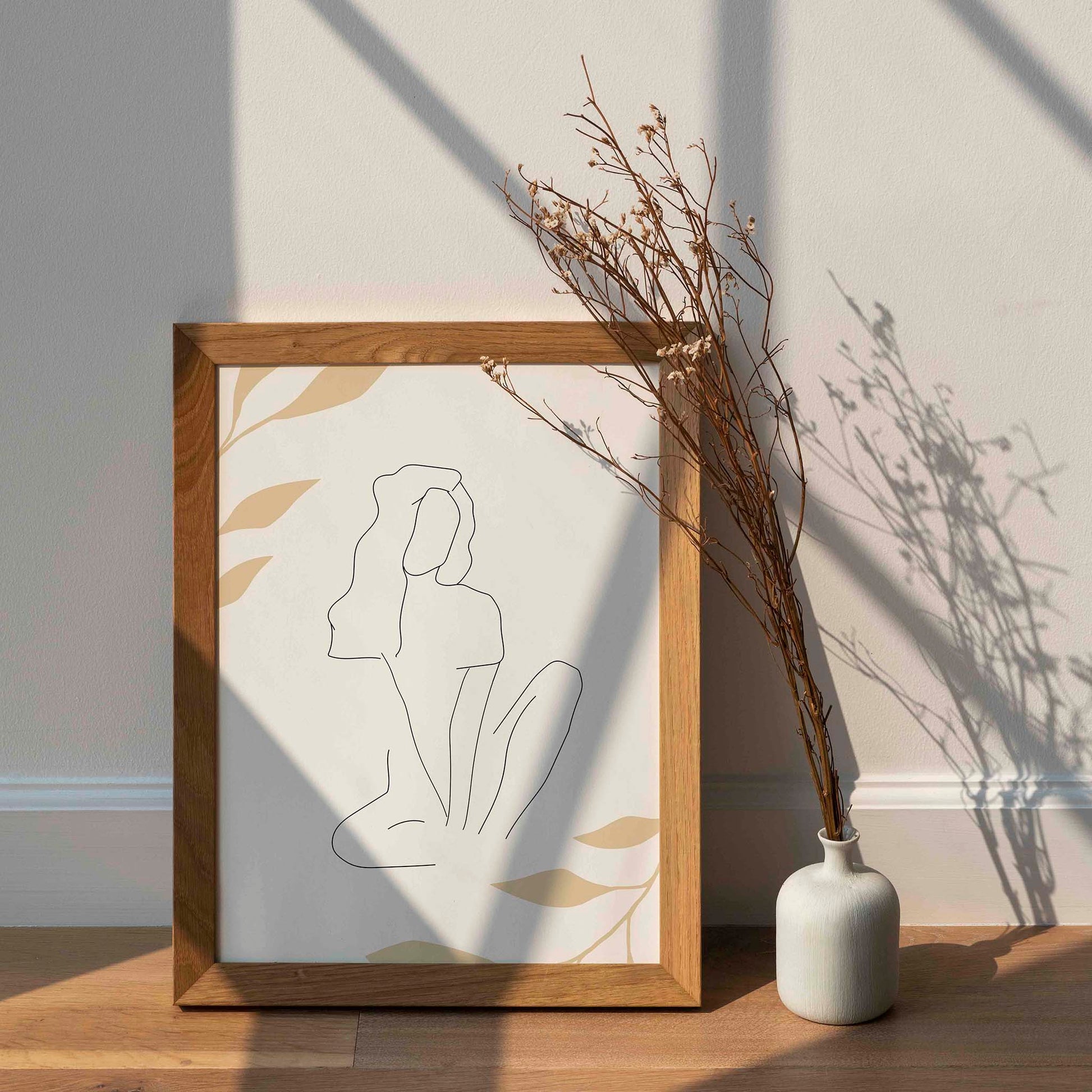 Minimalist line art of a seated woman with flowing hair, drawn in a single continuous stroke, surrounded by soft beige botanical elements on a light background, perfect for serene and modern interiors