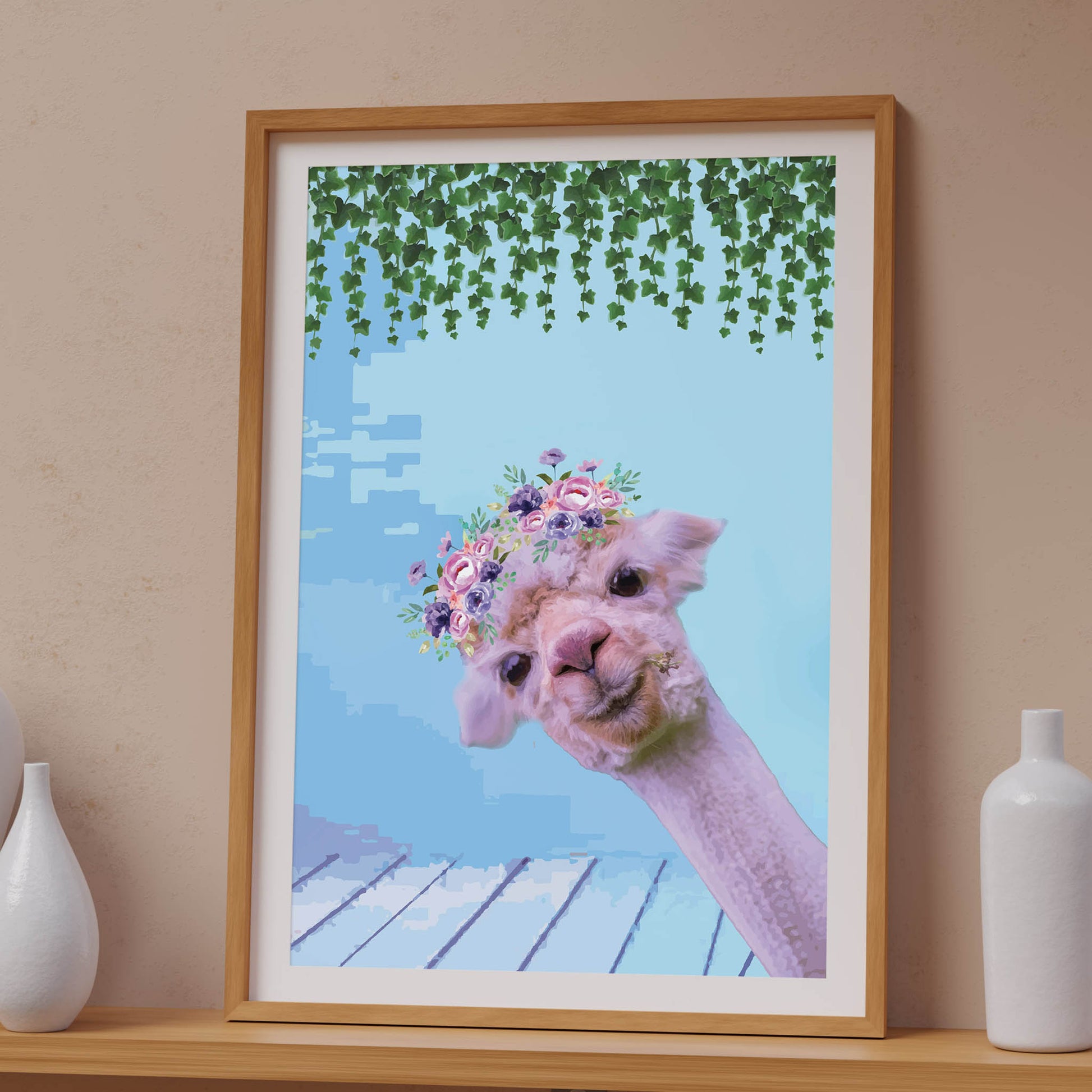 Whimsical printable wall art featuring a cute alpaca with a floral crown, set against a pastel blue background with hanging greenery, perfect for kids’ rooms, nurseries, or boho animal decor lovers.