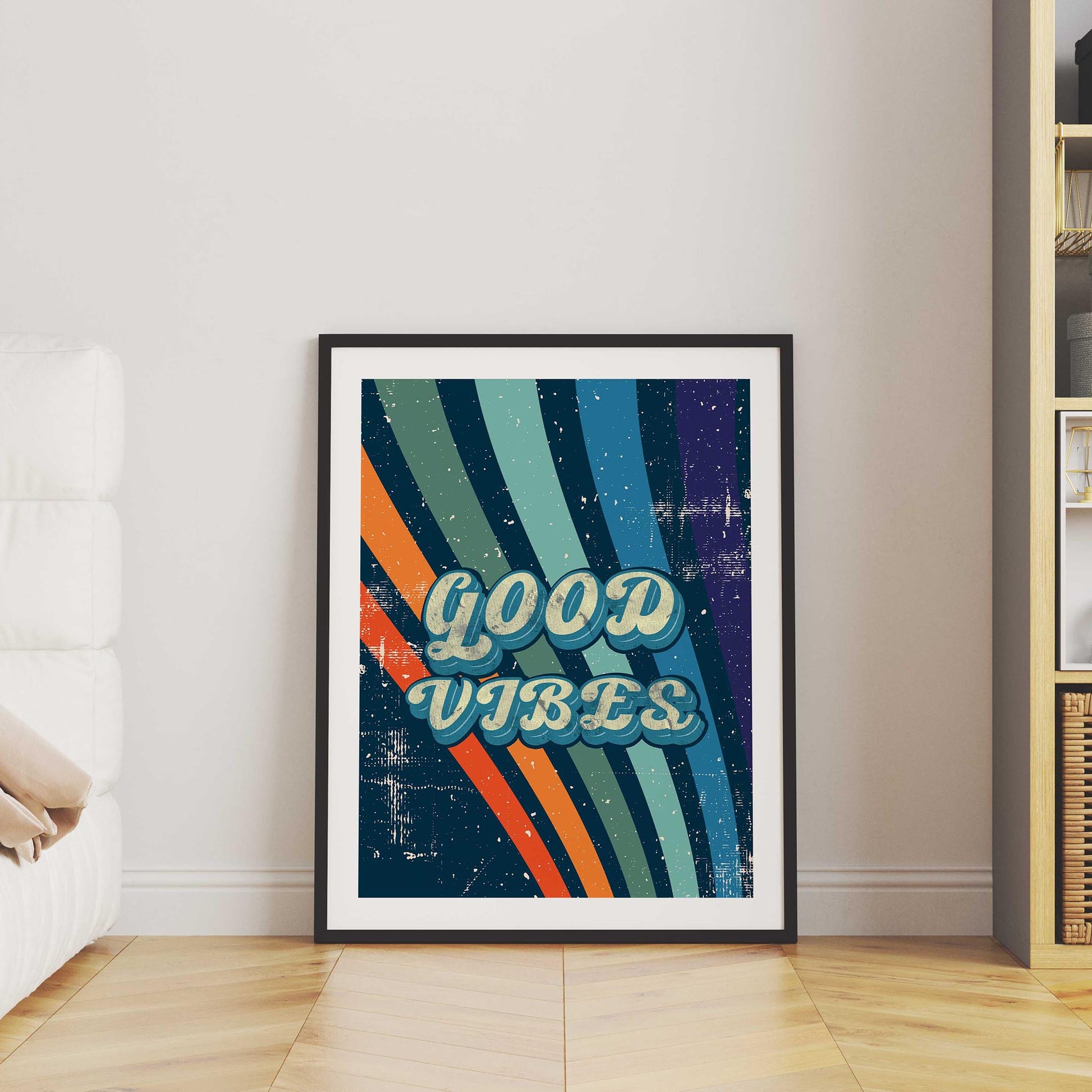 Printable wall art with a retro ‘Good Vibes’ typography in bold vintage-style letters, over a colorful striped background with a distressed, textured finish, perfect for positive, nostalgic home decor
