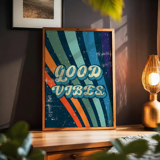 Printable wall art with a retro ‘Good Vibes’ typography in bold vintage-style letters, over a colorful striped background with a distressed, textured finish, perfect for positive, nostalgic home decor