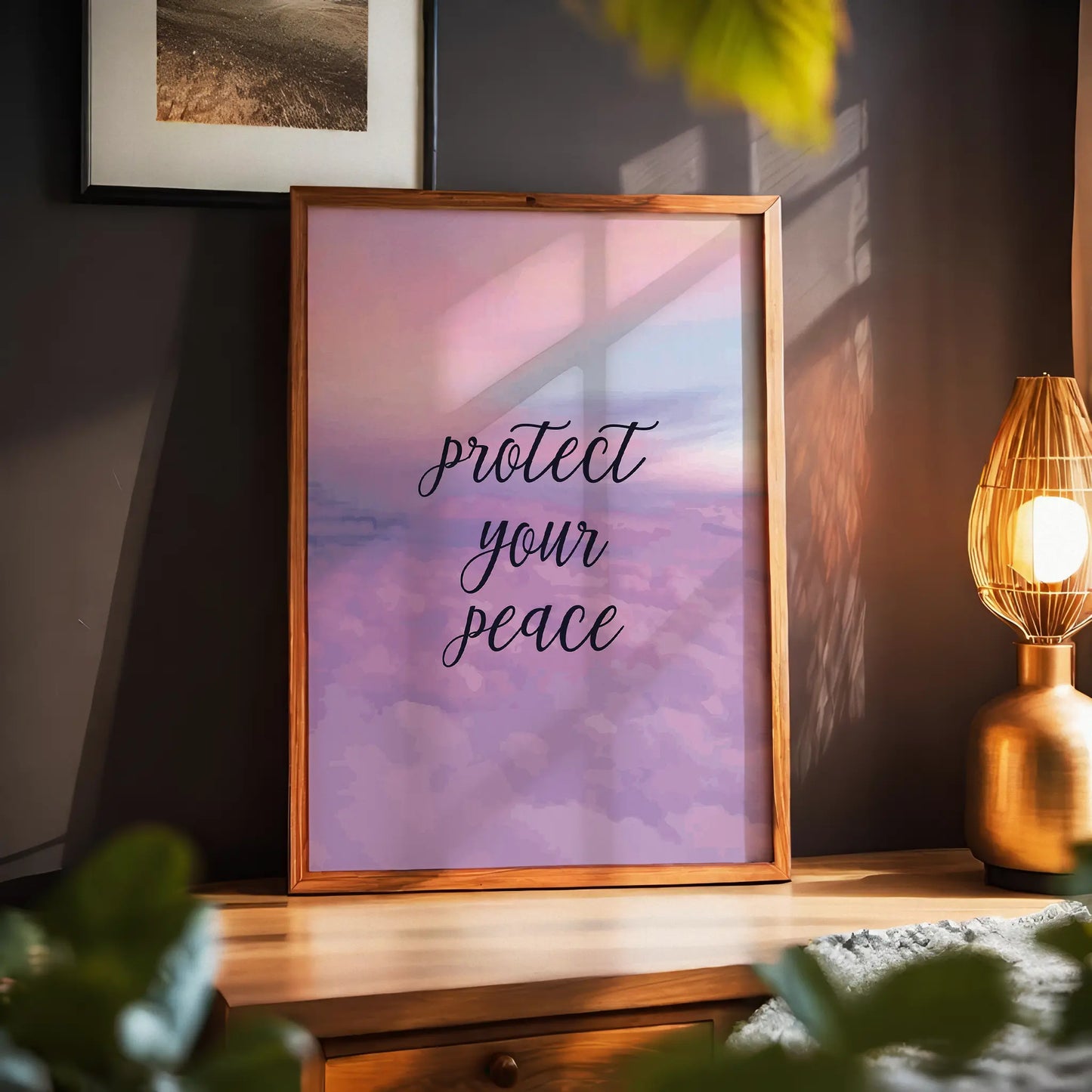 Serene printable wall art featuring the handwritten-style quote 'Protect your peace' in elegant black script over a dreamy pastel sky and clouds background with soft light reflections, perfect for self-care spaces, meditation rooms, or calming home decor