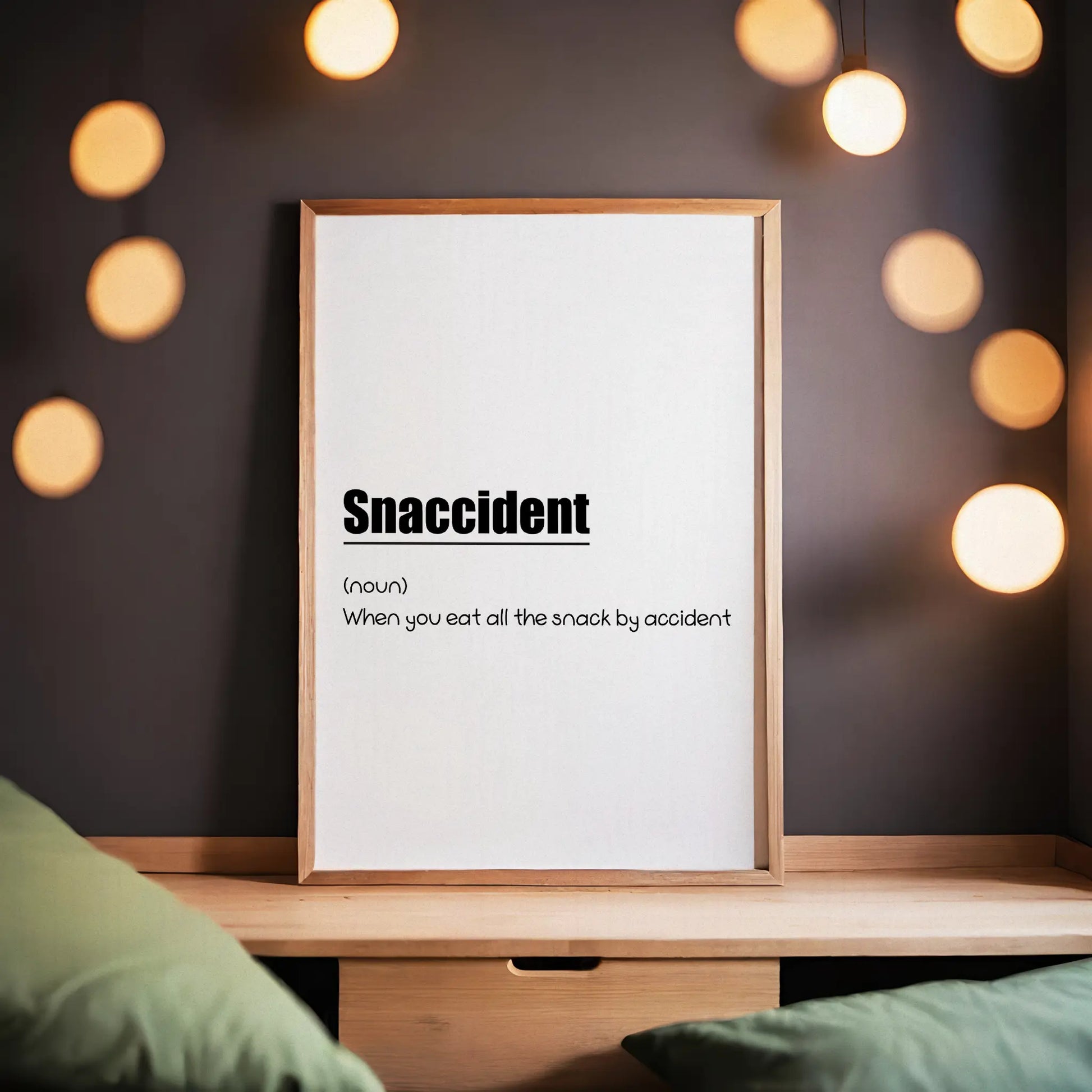 Funny printable wall art with the humorous definition 'Snaccident (noun): When you eat all the snack by accident' in playful black typography on a clean white background - perfect for kitchens, dining areas, or gift decor for food lovers