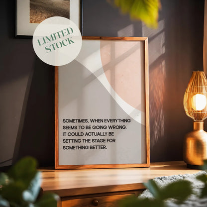Modern motivational printable wall art featuring the quote 'Sometimes, when everything seems to be going wrong, it could actually be setting the stage for something better' in black text over abstract curved shapes in soft beige and peach tones, perfect for uplifting and calming interior spaces