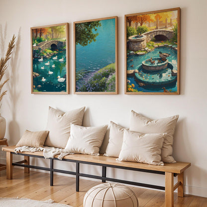 Three-piece framed artwork set leaning on a shelf with tranquil pond, lakeside and garden fountain illustrations