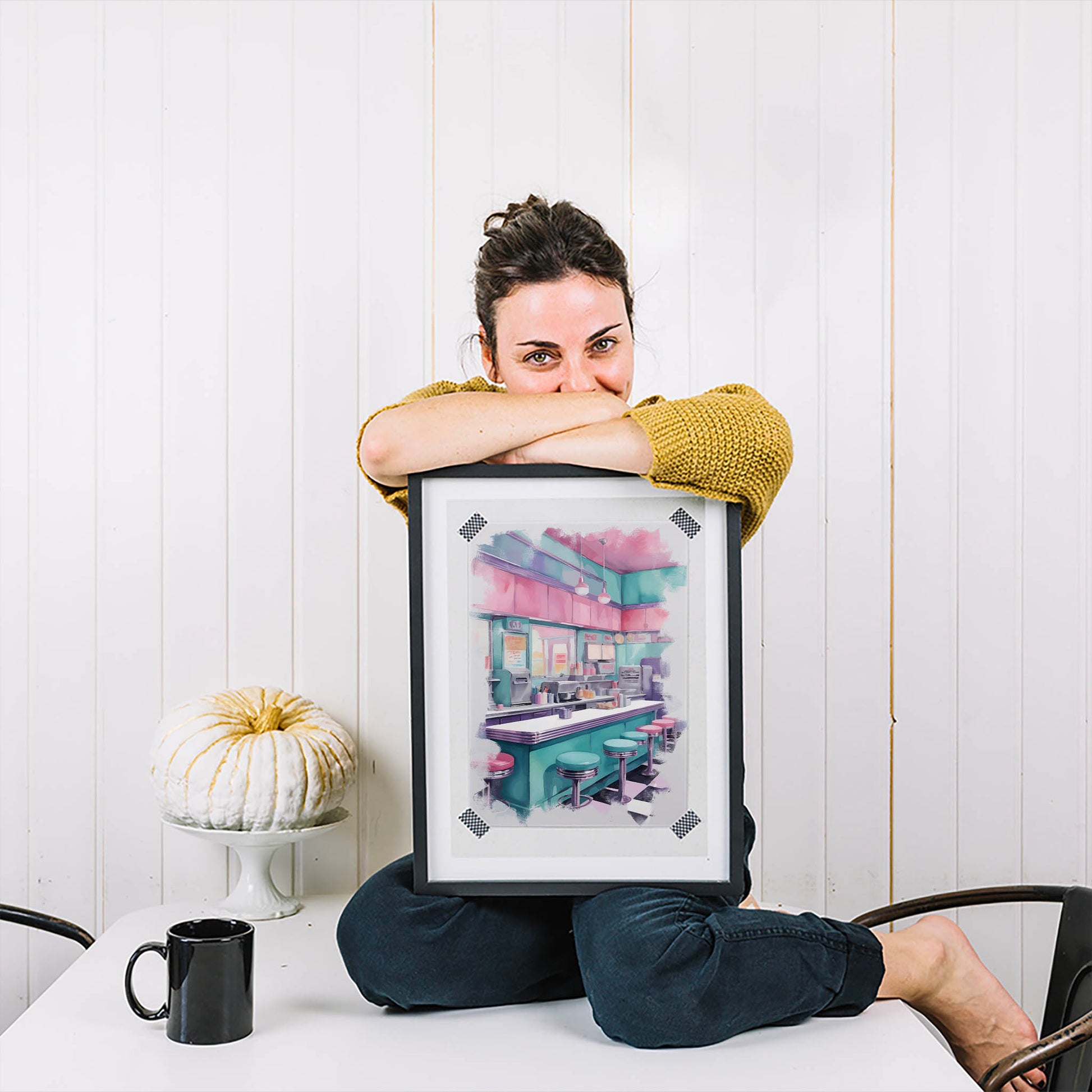 Retro American diner interior illustrated in soft pastel tones, featuring a teal counter, pink and turquoise bar stools, hanging pendant lights, and classic checkerboard flooring. The nostalgic 1950s-style diner scene creates a cozy, vintage atmosphere with a modern aesthetic twist. Digital Download. Printable Wall Art.