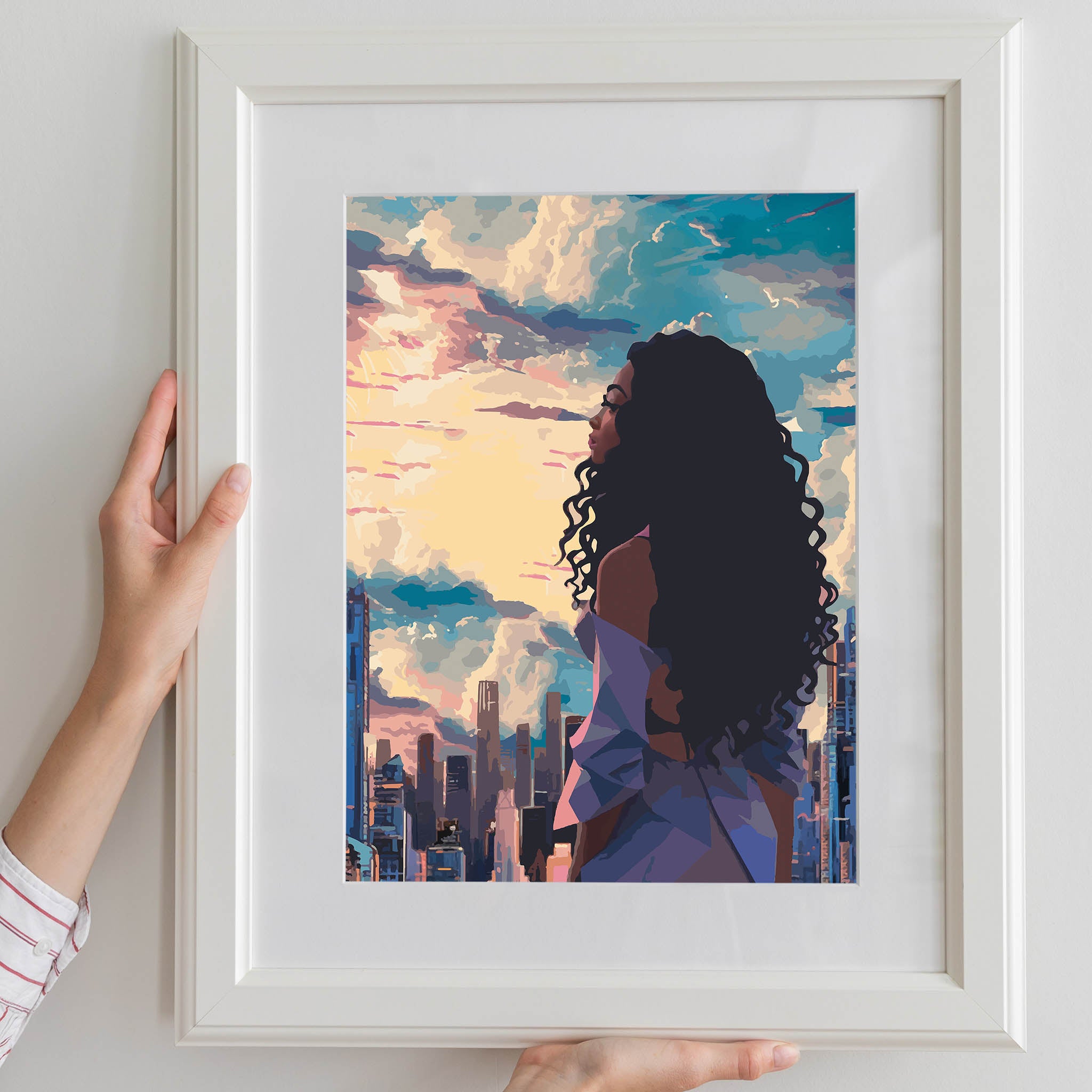 Modern cityscape printable wall art featuring a confident woman with long curly hair gazing at a vibrant sunset skyline - perfect for urban, empowering, and contemporary decor themes