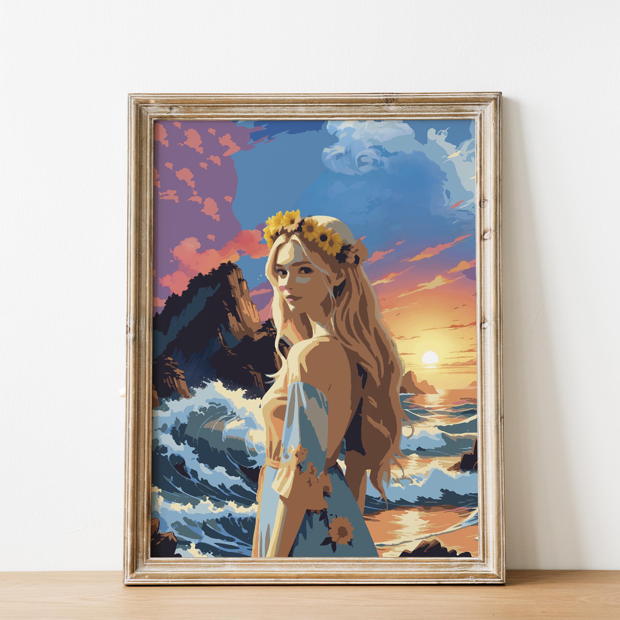 Vibrant printable wall art featuring a blonde woman with sunflowers in her hair standing by the ocean, set against dramatic waves, rocky cliffs, and a glowing sunset sky, perfect for adding a bold, romantic coastal vibe to any space