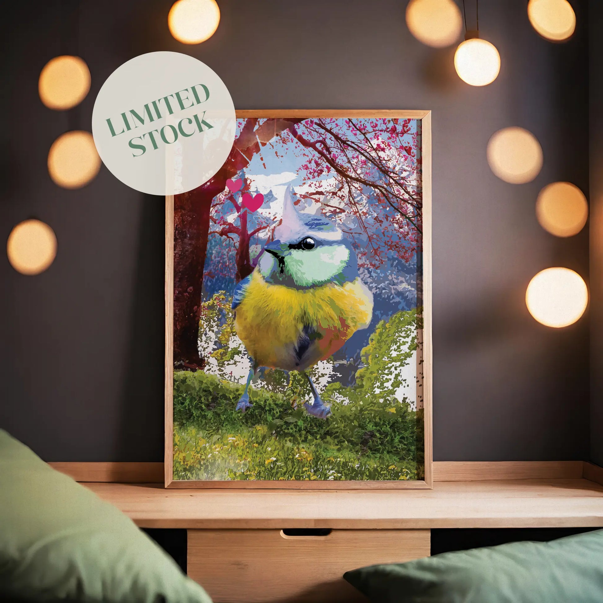 Printable wall art of a colorful songbird with vibrant blue, yellow, and green feathers standing on grass, with a dreamy cherry blossom tree, mountains, and pink hearts in the background, perfect for nature lovers and whimsical home decor