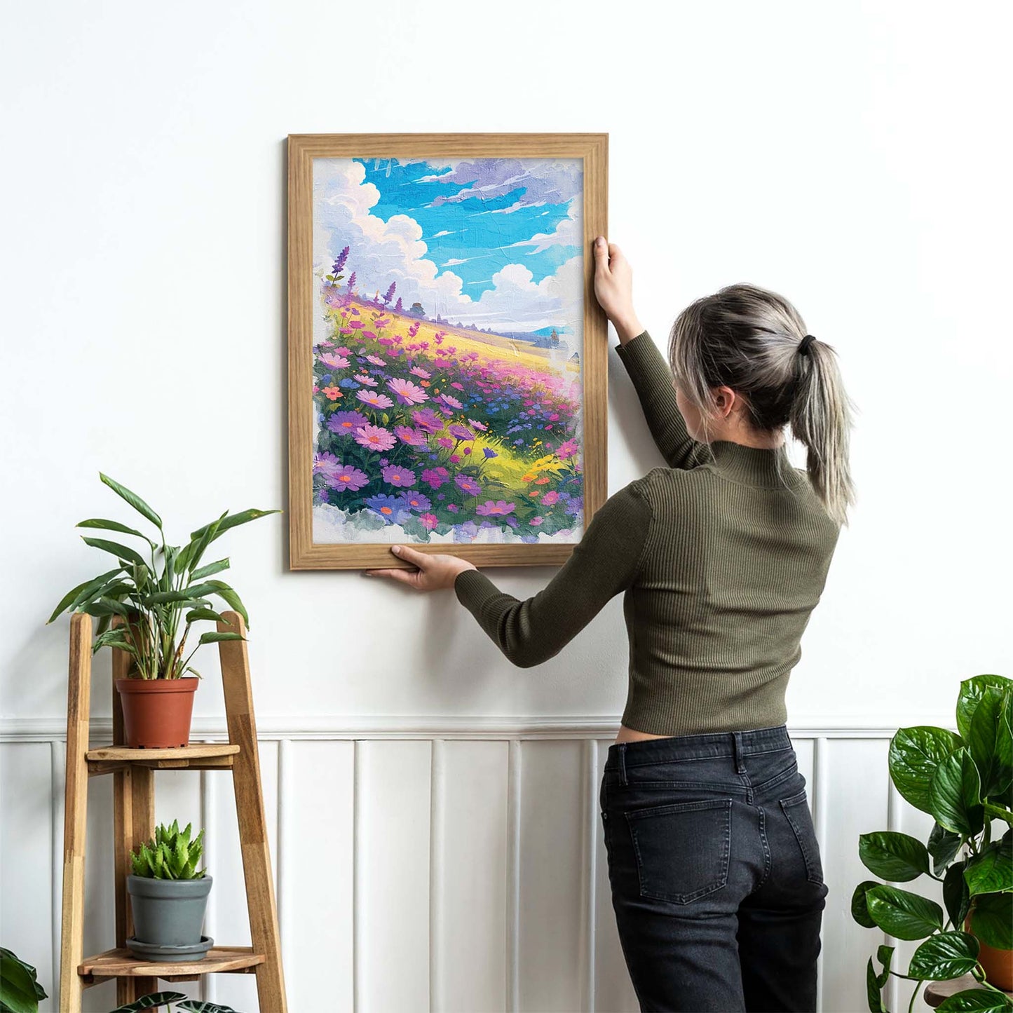 Vibrant printable wall art of a dreamy wildflower field in full bloom, featuring purple, pink, and blue blossoms under a bright blue sky with fluffy clouds, evoking warmth, joy, and a touch of whimsy