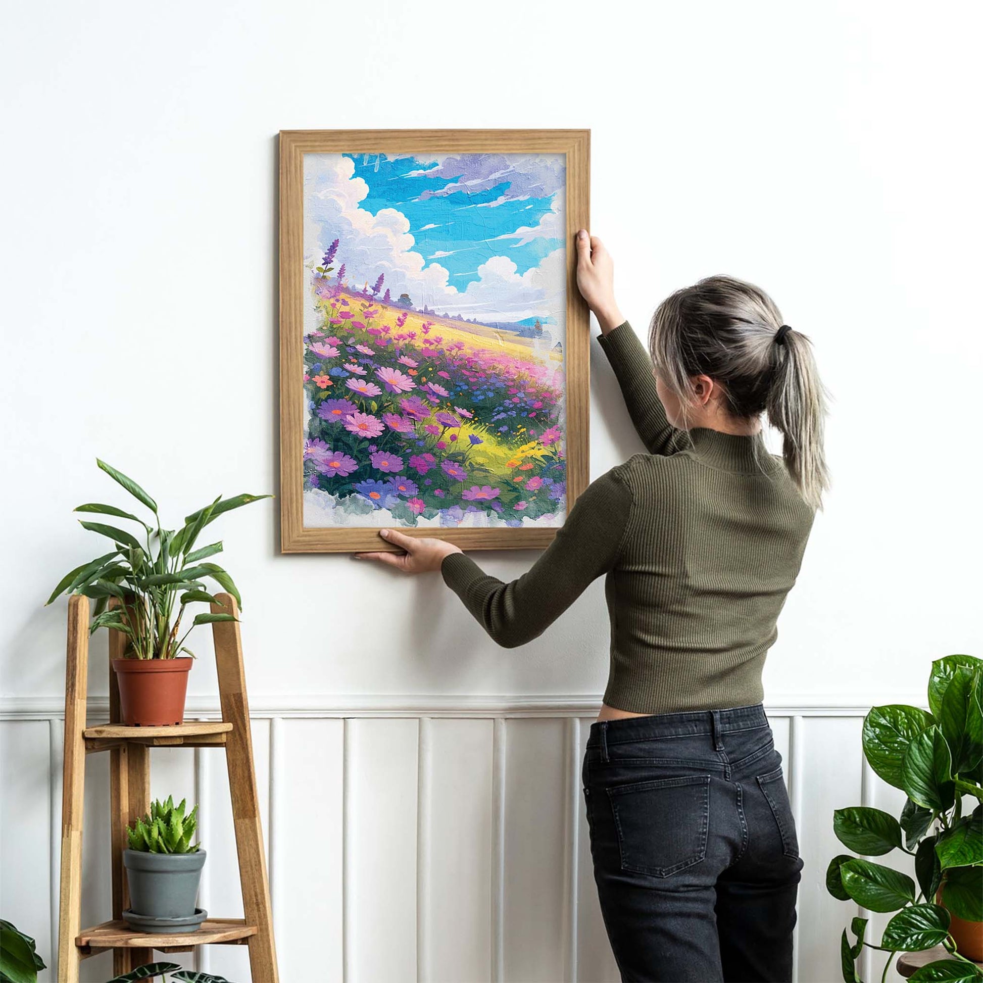 Vibrant printable wall art of a dreamy wildflower field in full bloom, featuring purple, pink, and blue blossoms under a bright blue sky with fluffy clouds, evoking warmth, joy, and a touch of whimsy
