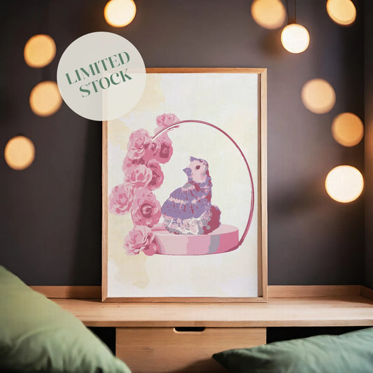 Printable wall art of a whimsical cat wearing a frilly purple dress, sitting on a round pink pedestal adorned with pink roses and a delicate arch, perfect for romantic, feminine home decor