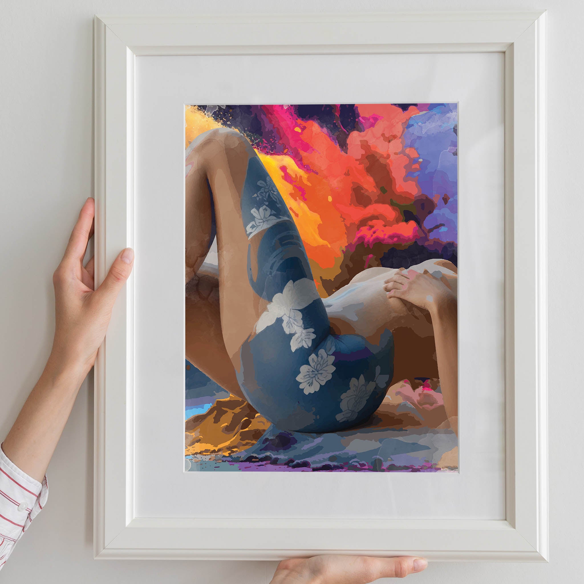 Bold and sensual printable wall art featuring a reclining nude female figure with floral body art, set against a dramatic, abstract explosion of fiery colours, perfect for modern, expressive, and statement-making interiors