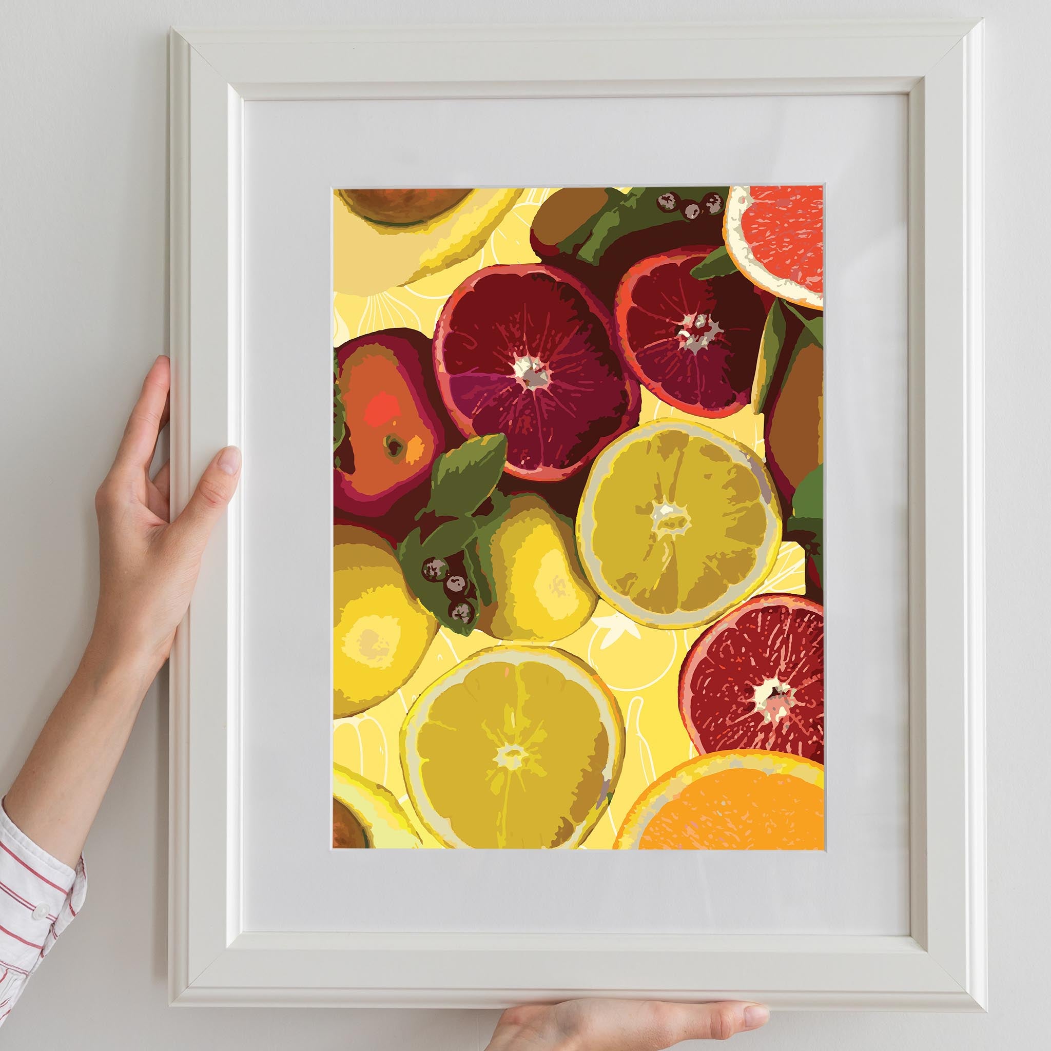 Bold and colorful printable wall art of sliced citrus fruits including blood oranges, lemons, and grapefruits on a vibrant yellow background, ideal for brightening up kitchens, cafes, or fruit-themed decor spaces
