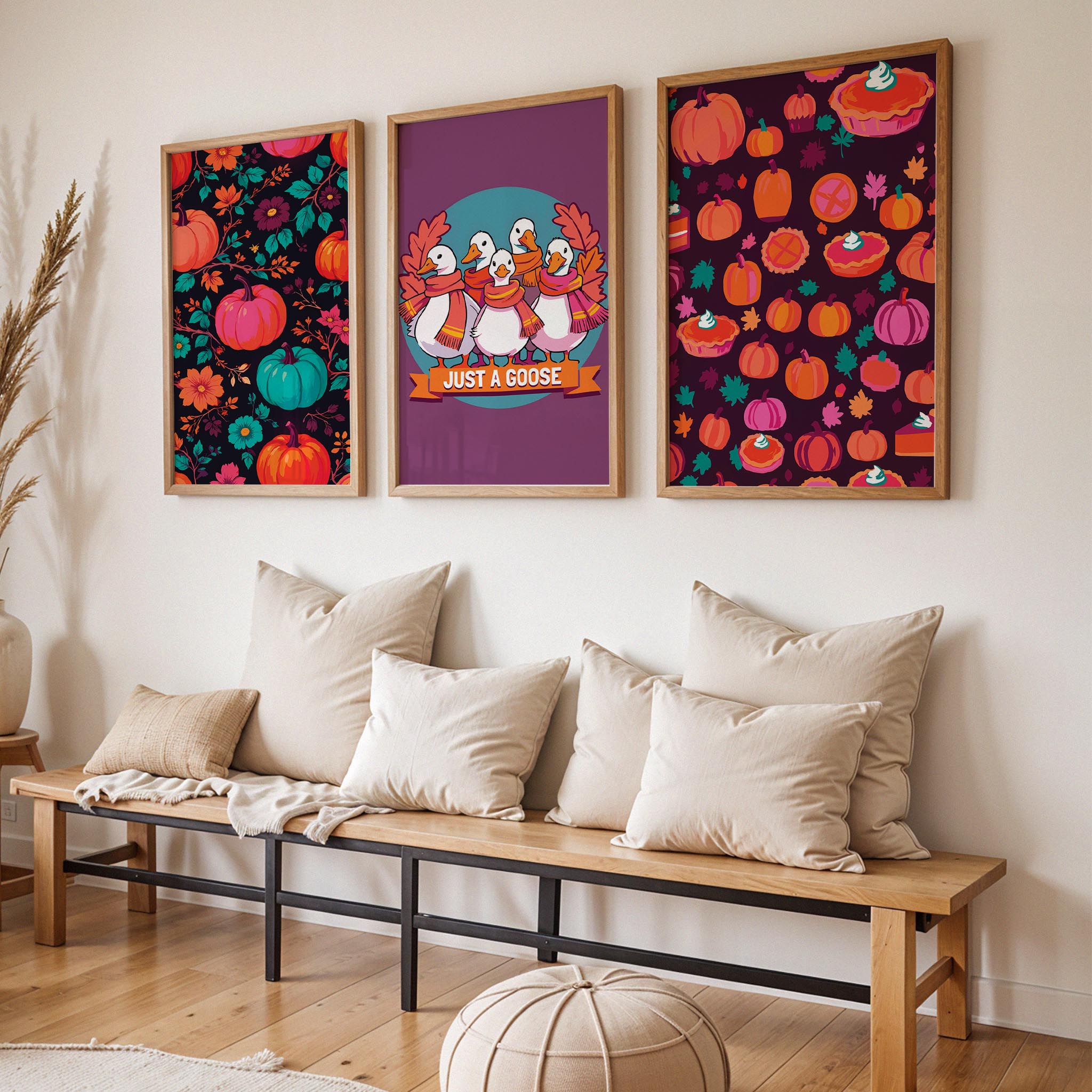 Three SweetPixelCreations dark autumn prints propped on a wood shelf against sage wainscoting - bold jewel-toned fall patterns and a funny goose character print in a richly coloured moody palette with teal accents