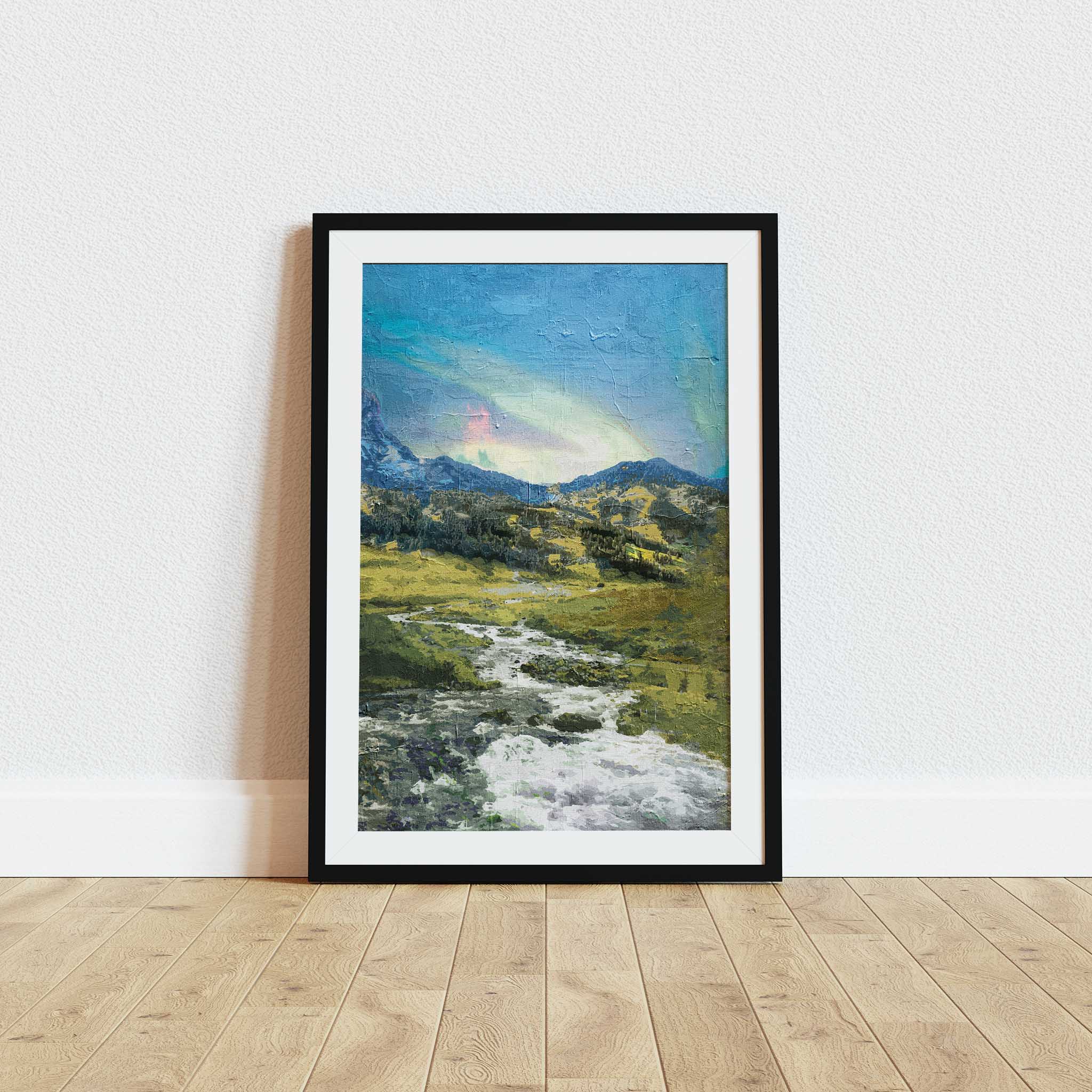 Rustic mountain valley wall art featuring a flowing stream winding through grassy hills and rocky terrain, with forested slopes and a soft, colorful sky above the distant peaks