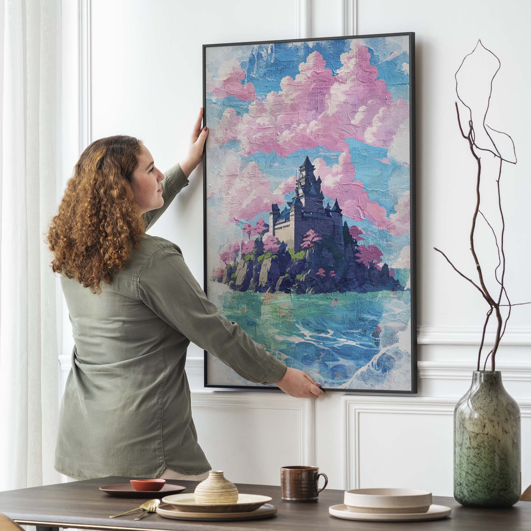 Dreamy fantasy castle wall art featuring a majestic stone castle perched on a rocky island, surrounded by turquoise waters and pink cherry blossom trees, under a sky filled with cotton candy clouds