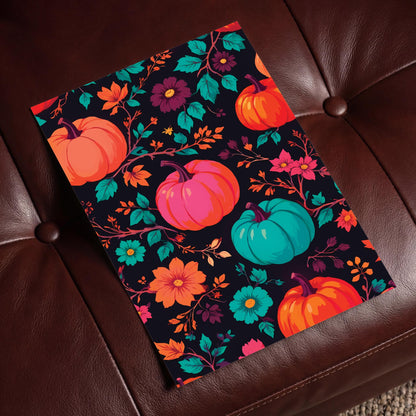 Maximalist fall pattern print featuring multicolour pumpkins in orange, magenta, and teal surrounded by wildflowers, trailing branches, and foliage on a deep black backdrop