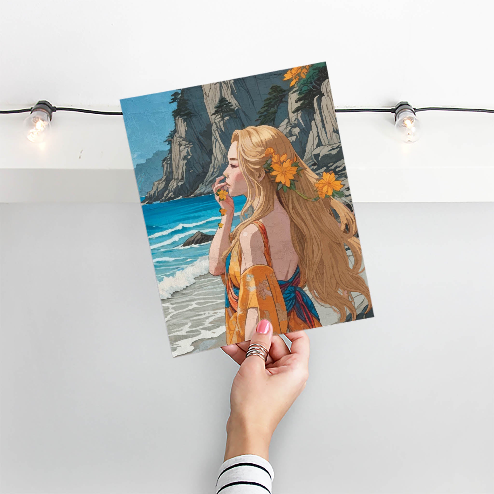 Elegant digital painting of a blonde woman in a floral robe standing by the ocean, surrounded by cliffs and yellow flowers, coastal boho wall art print