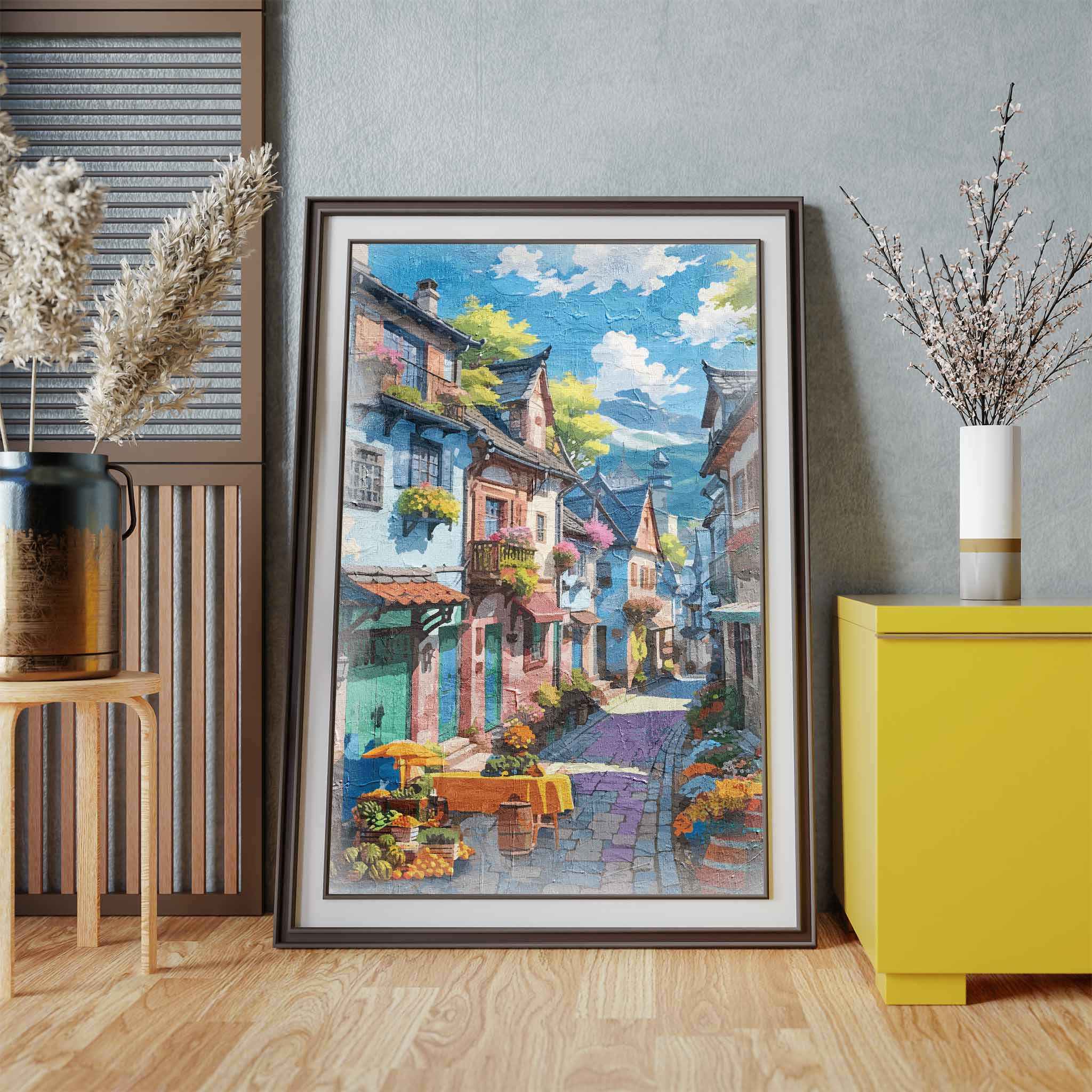 Charming printable wall art of a colorful European-style village street, lined with flower-filled balconies, cobblestone paths, and a market table with fruits and flowers under a sunny blue sky, perfect for travel-inspired, vintage, or Mediterranean-themed decor