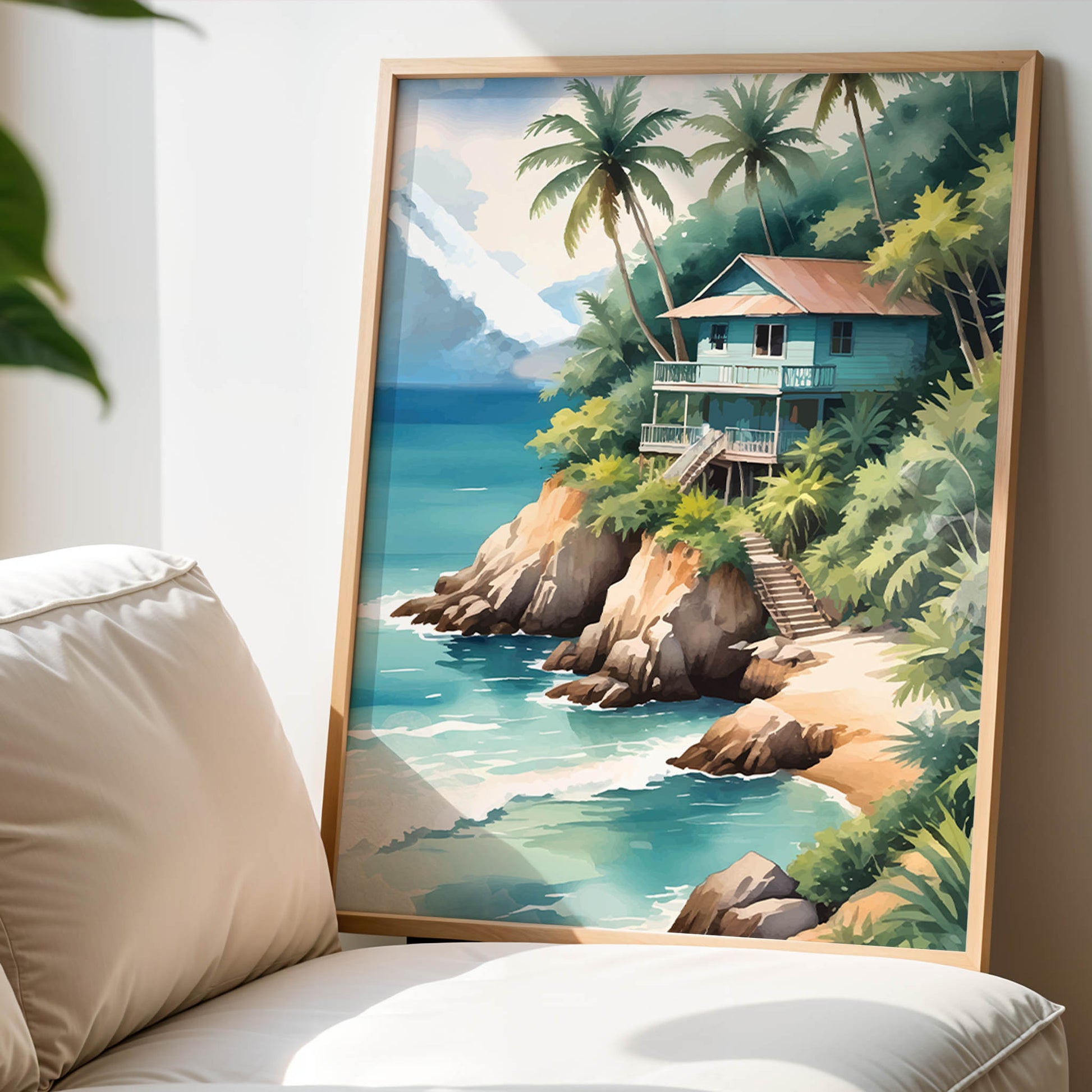 Tropical beach wall art of a wooden house on a cliff surrounded by palm trees, overlooking turquoise ocean waves with mountains in the background