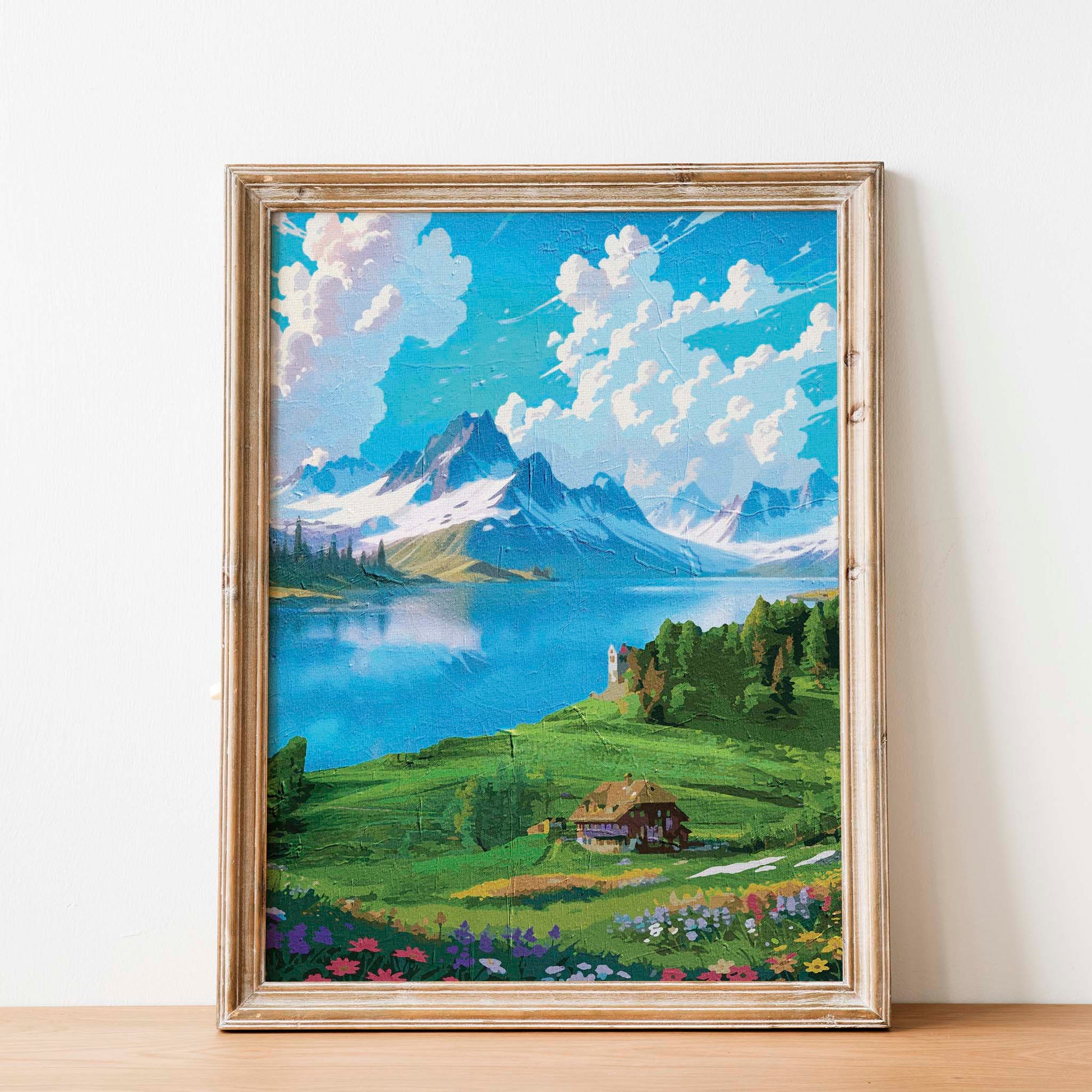 Vibrant digital painting of a scenic alpine landscape featuring a serene lake, snow-capped mountains, a cozy cottage, and blooming wildflowers - printable wall art for nature and travel lovers. 