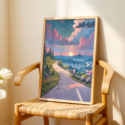 Scenic printable wall art featuring a winding mountain road at sunset, overlooking a serene cityscape with glowing skies, pine trees, and vibrant pink clouds - ideal for travel and nature-inspired home decor