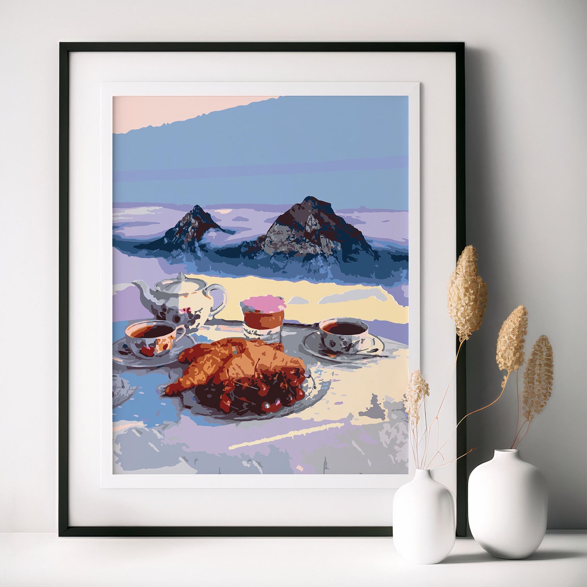 Cozy printable wall art of a serene alpine breakfast scene featuring croissants, tea, and coffee with a majestic mountain backdrop, perfect for kitchen or café-inspired decor