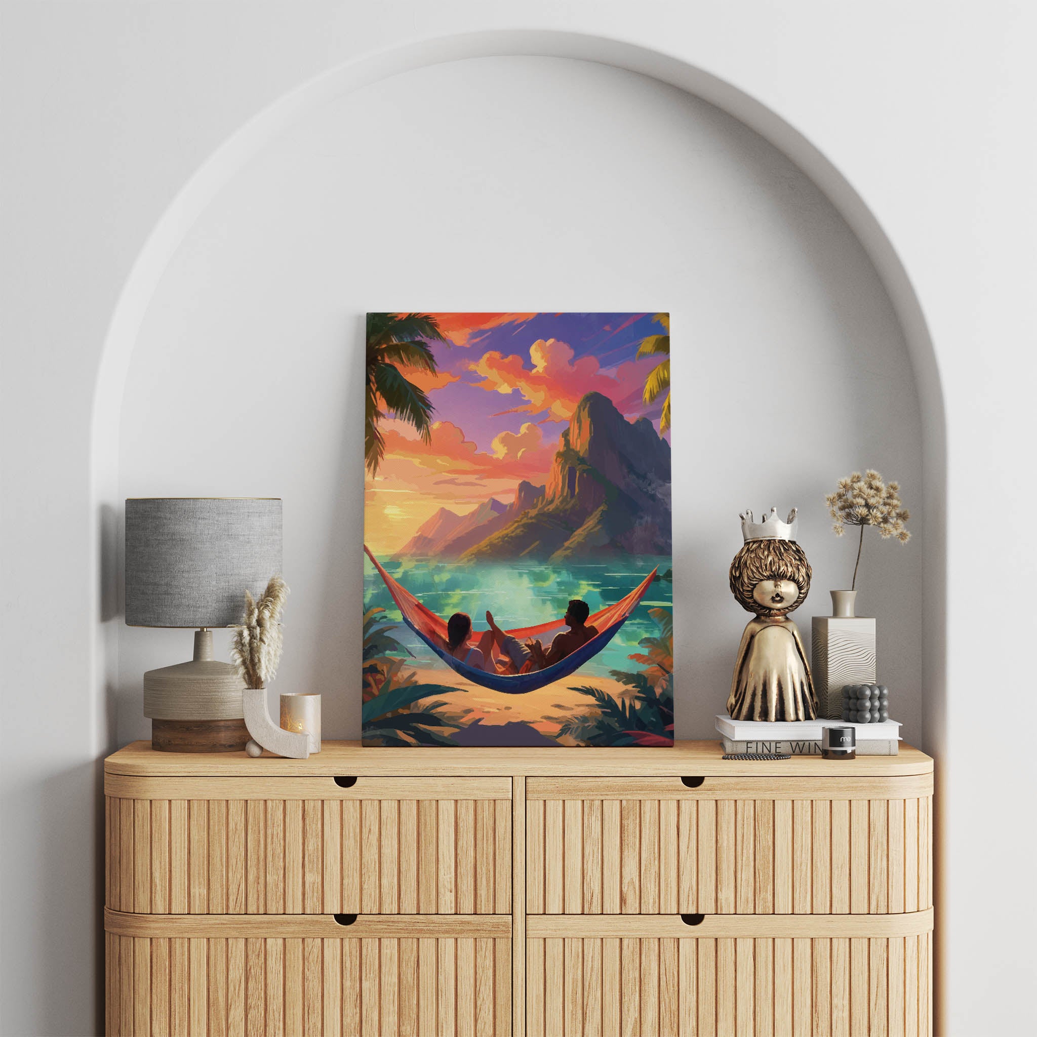 Romantic tropical sunset wall art showing a couple relaxing in a hammock by the beach, with palm trees, turquoise waters, and dramatic mountain cliffs under a vivid orange and pink sky