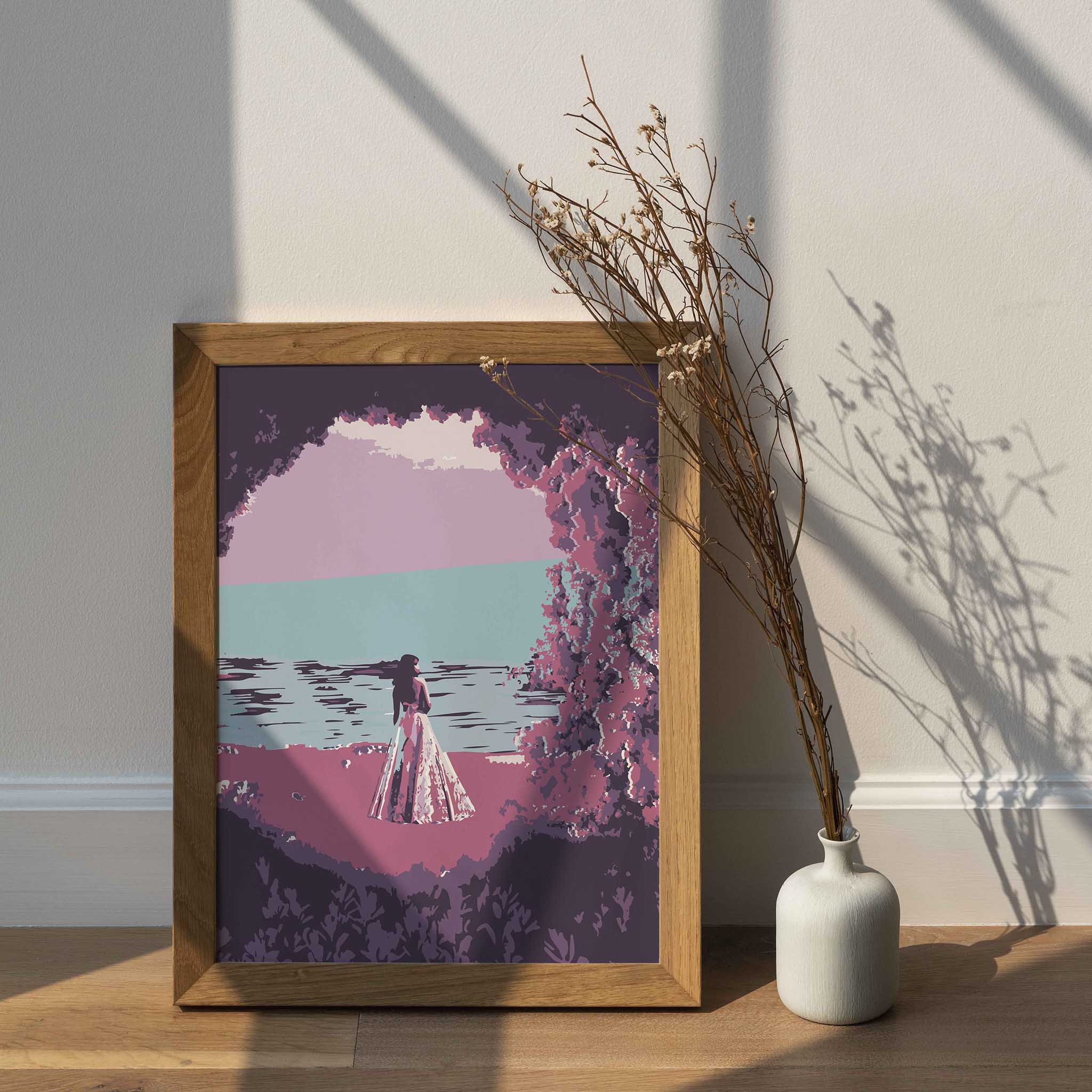 Dreamy beach wall art featuring a woman in a flowing dress standing by the ocean, framed by pink and purple foliage, with a calm sea and pastel sky creating a serene, romantic atmosphere