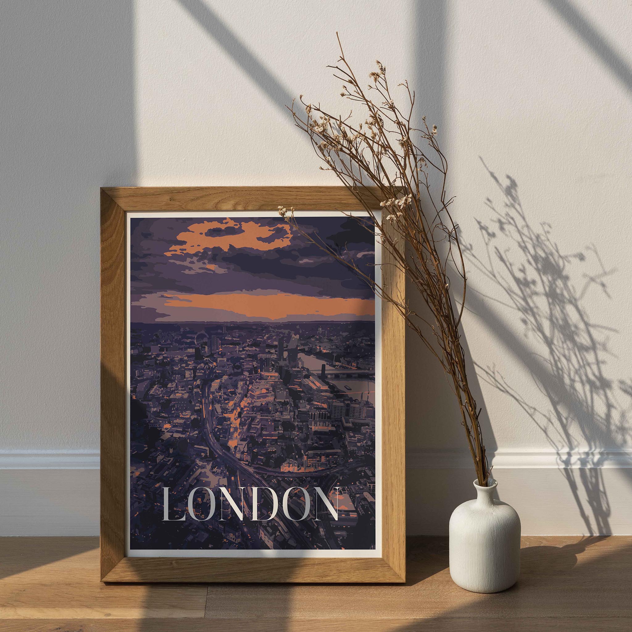 Modern London cityscape wall art featuring a moody aerial view of the city at sunset, with glowing orange and purple tones, iconic architecture, the River Thames, and bold 'LONDON' text at the bottom