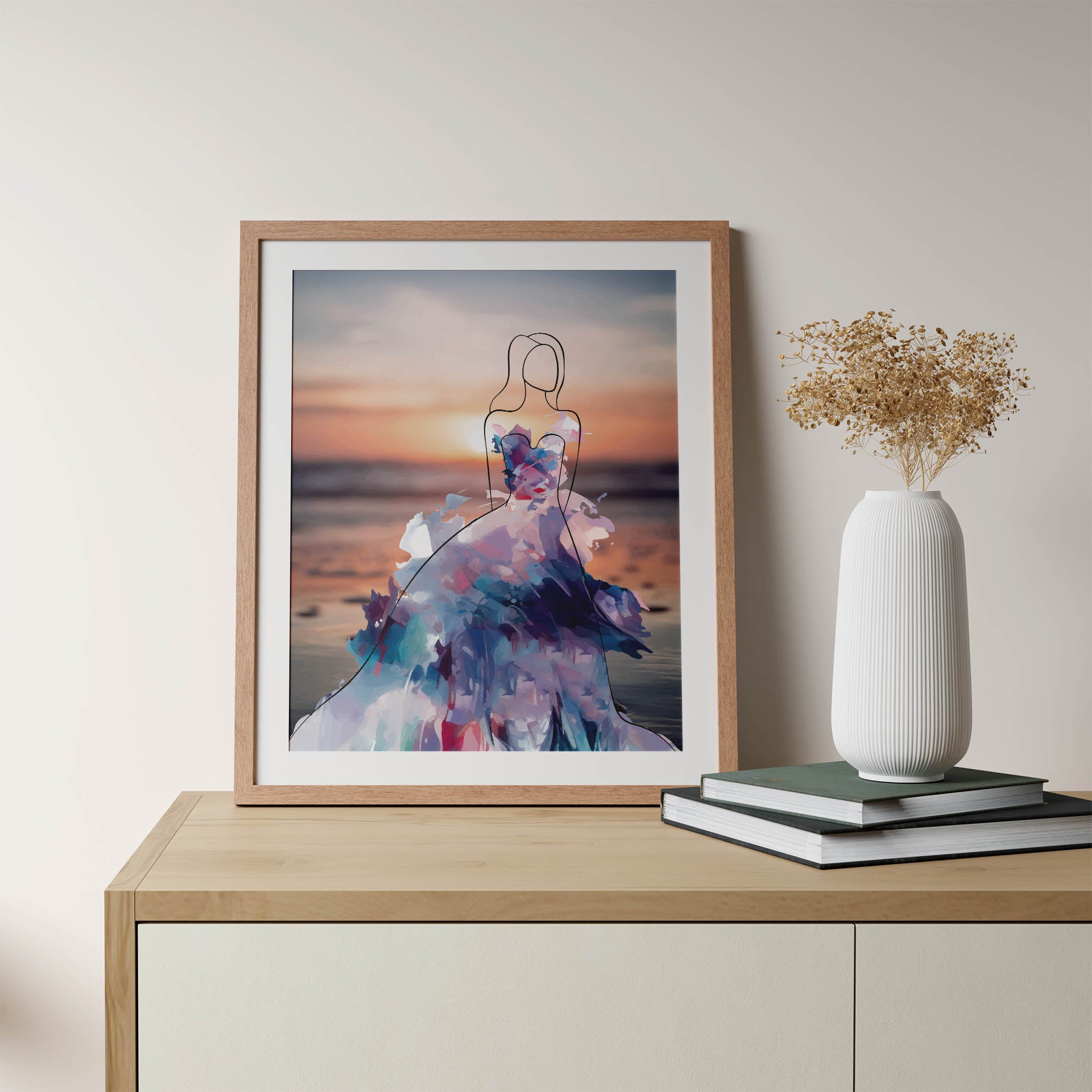 Elegant printable wall art featuring a minimalist line drawing of a woman in a flowing, abstract watercolour gown with vibrant purples, blues, and pinks, set against a serene sunset beach background, perfect for modern, fashion-inspired interiors