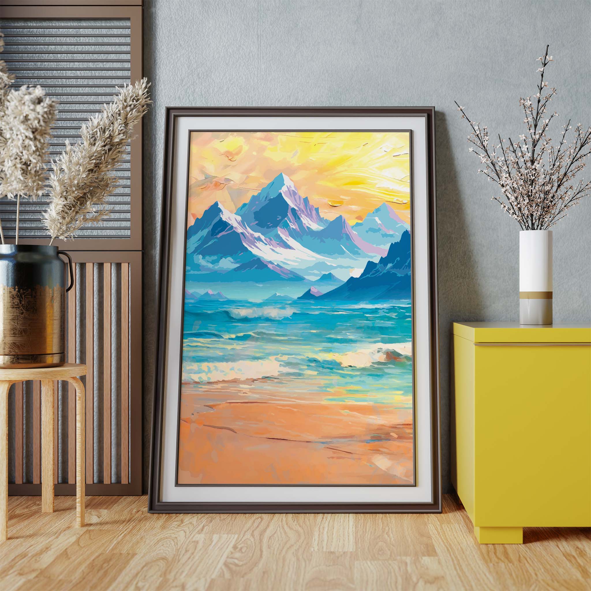 Majestic mountain landscape wall art featuring snow-capped peaks above a serene turquoise lake and sandy shoreline, with a glowing sunrise casting golden hues across the sky